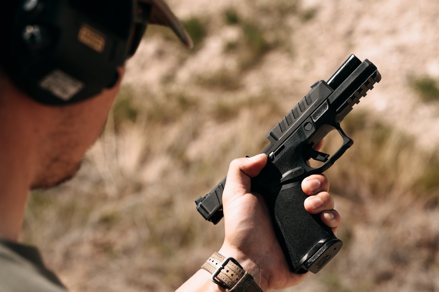 In this image, the shooter demonstrates what a slide lock reload looks like.