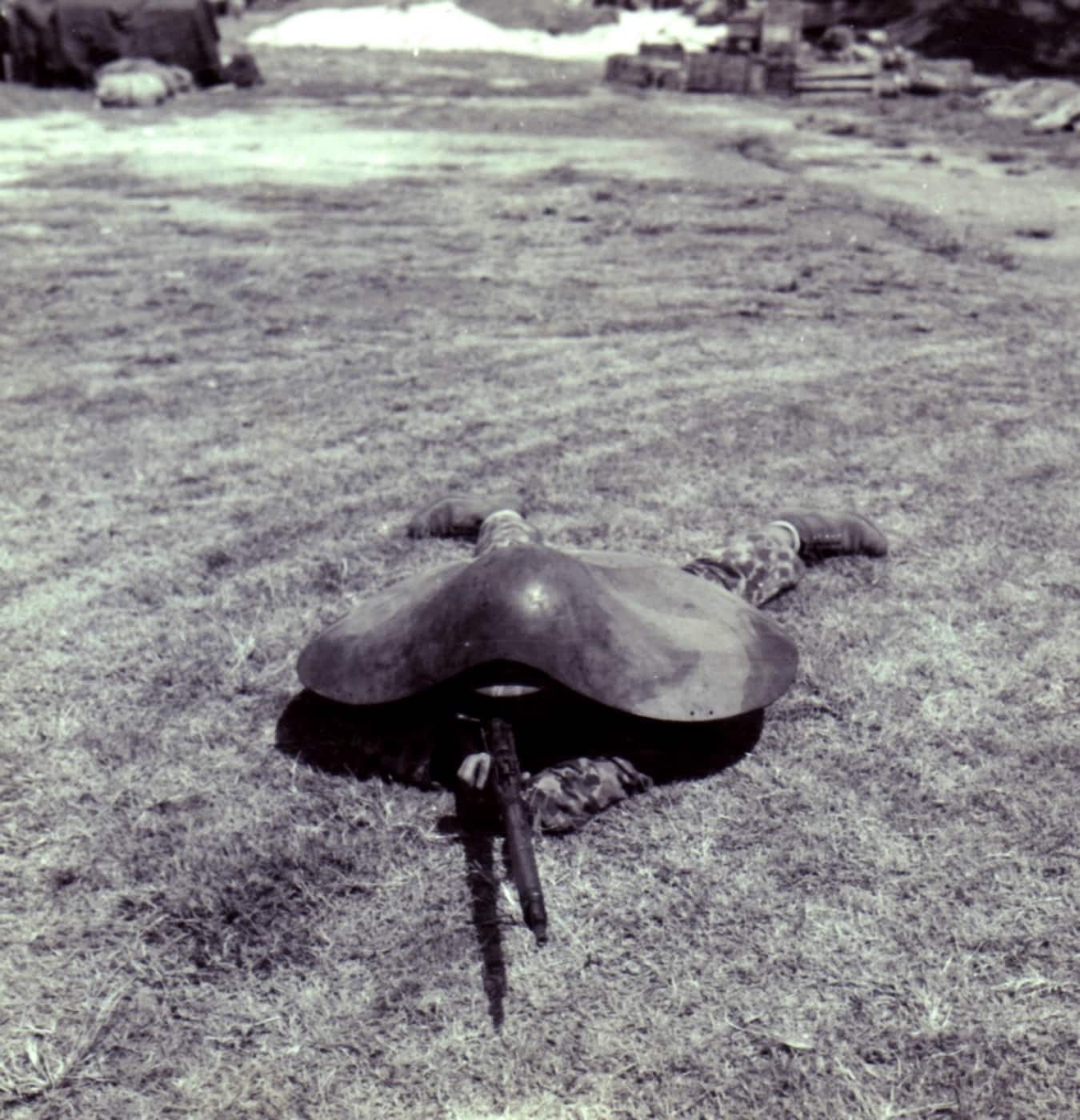 In this photograph we see a Marine testing the captured Japanese armor.