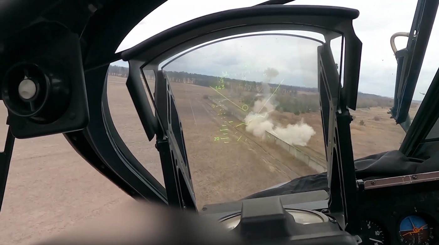 In this unusual photo taken from the interior of a Ka-52, we see the Russian helicopter engaging Ukrainian military forces at the Antonov Airport. Shortly after this image was taken, the Ka-52 and several Mi-8 helicopters were shot down with anti-aircraft missiles.
