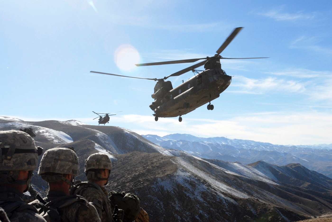 Chinook flying over US Army troops in Afghanistan