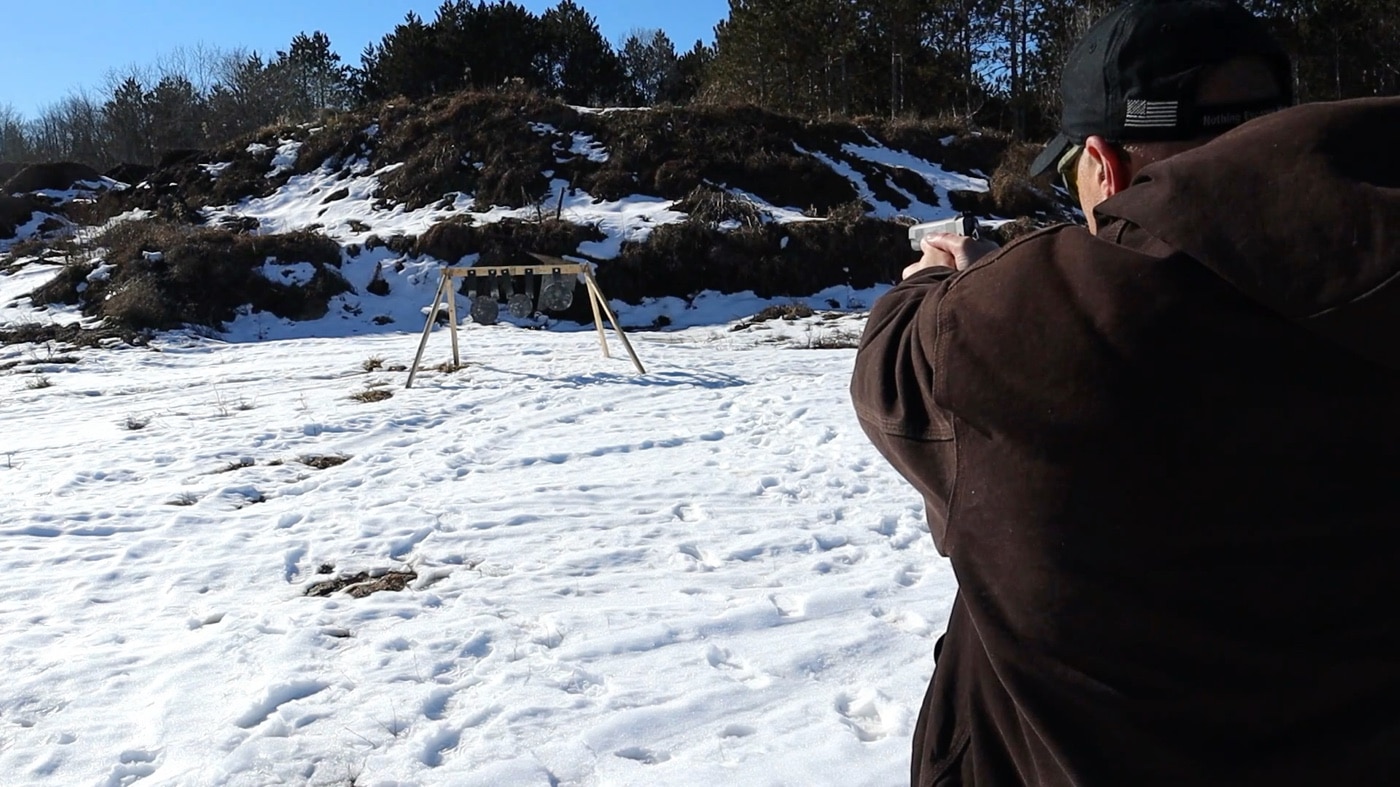 Garrison vs Emissary shooting steel in the snow at an outdoor range