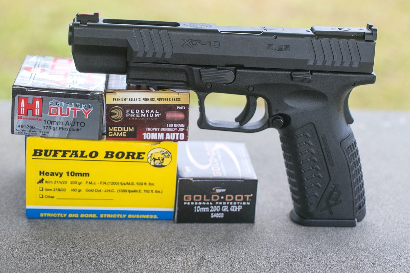 Massad Ayoob 10mm xd-m pistol and ammo