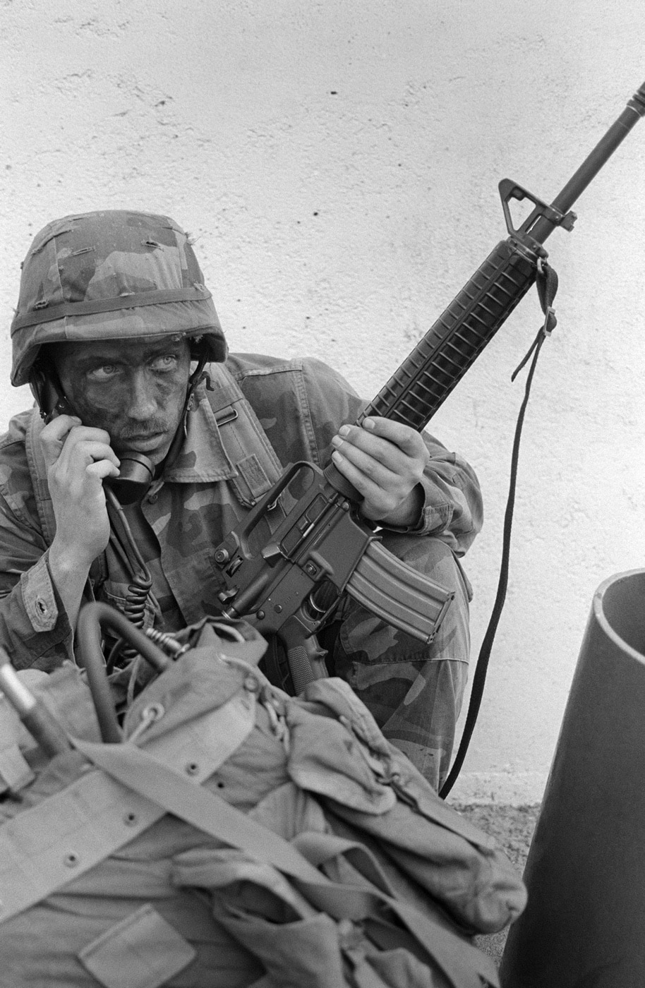 In this photograph, we see a Marine armed with an M16A2 rifle. He communicates with other members of the 11th Marine Expeditionary Unit during Exercise Valiant Usher 88 in the Philippines. The exercise included hostage rescue scenarios and special operations missions.