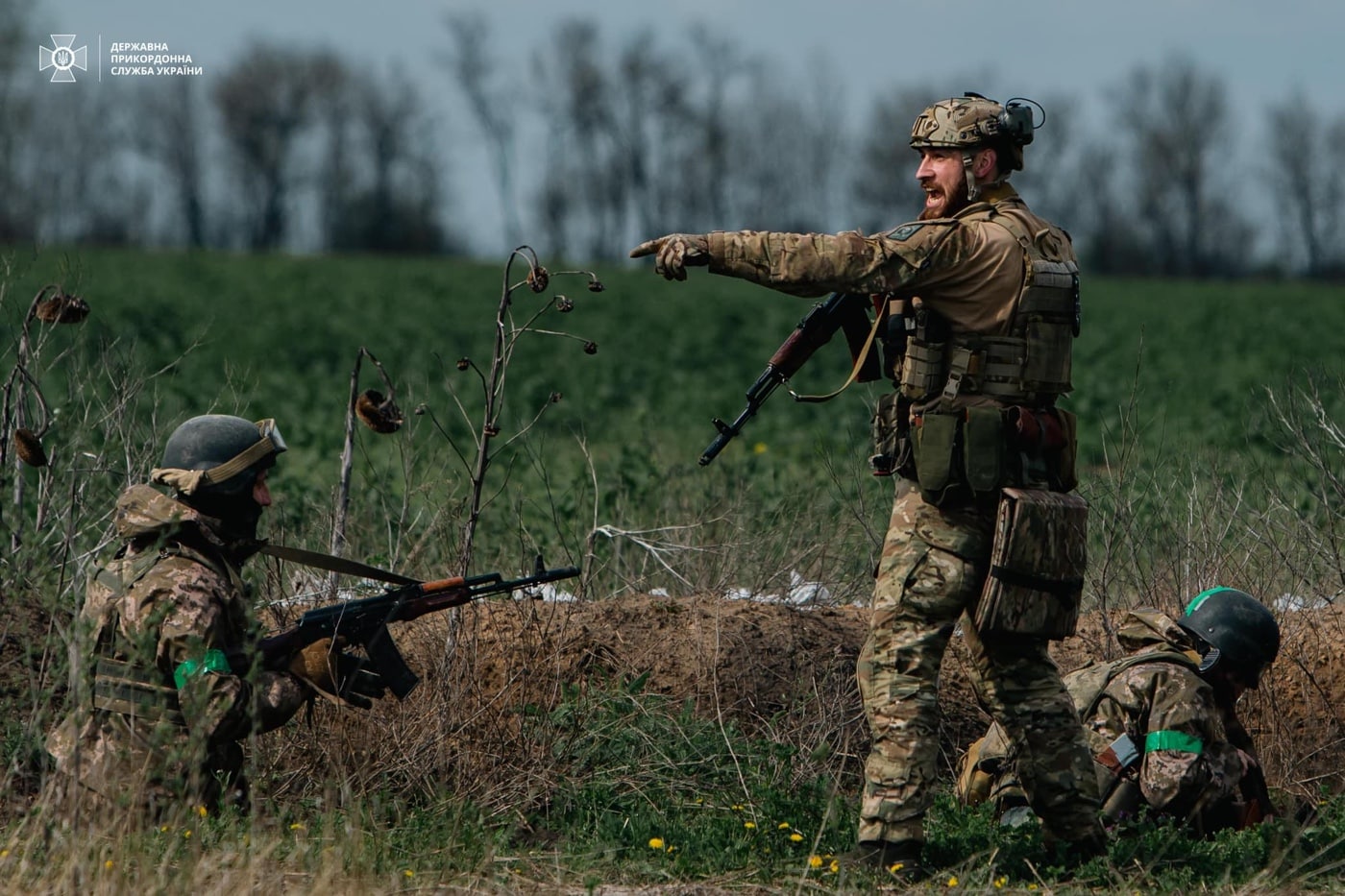 In this photograph we see three Ukraine Border Guards training with AK-74 rifles to fight Russian soldiers. 