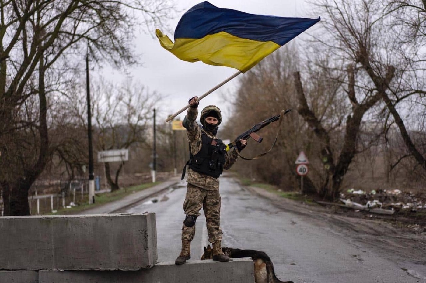 In this digital image, we see a Ukrainian soldier waving his country's flag. After the battle for Hostomel, the Russians discovered the war would not go the way they expected.