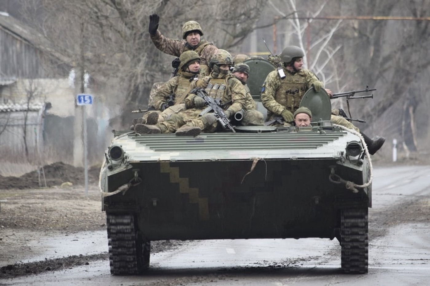 In this photograph, we see Ukrainian infantry riding a BMP-2 infantry fighting vehicle to engage the invaders. The Russian attack threatened the capital city, and these troops helped to stop the invaders in this early battle of the Russo-Ukrainian War. 
