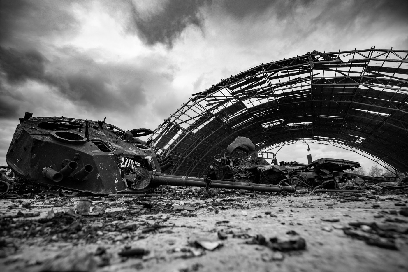 Shown in this photo is the destroyed turret of a BTR APC and a heavily damaged airplane hangar. Russian missile strikes and the battle for the airport did extensive damage to the facilities and surrounding town. 