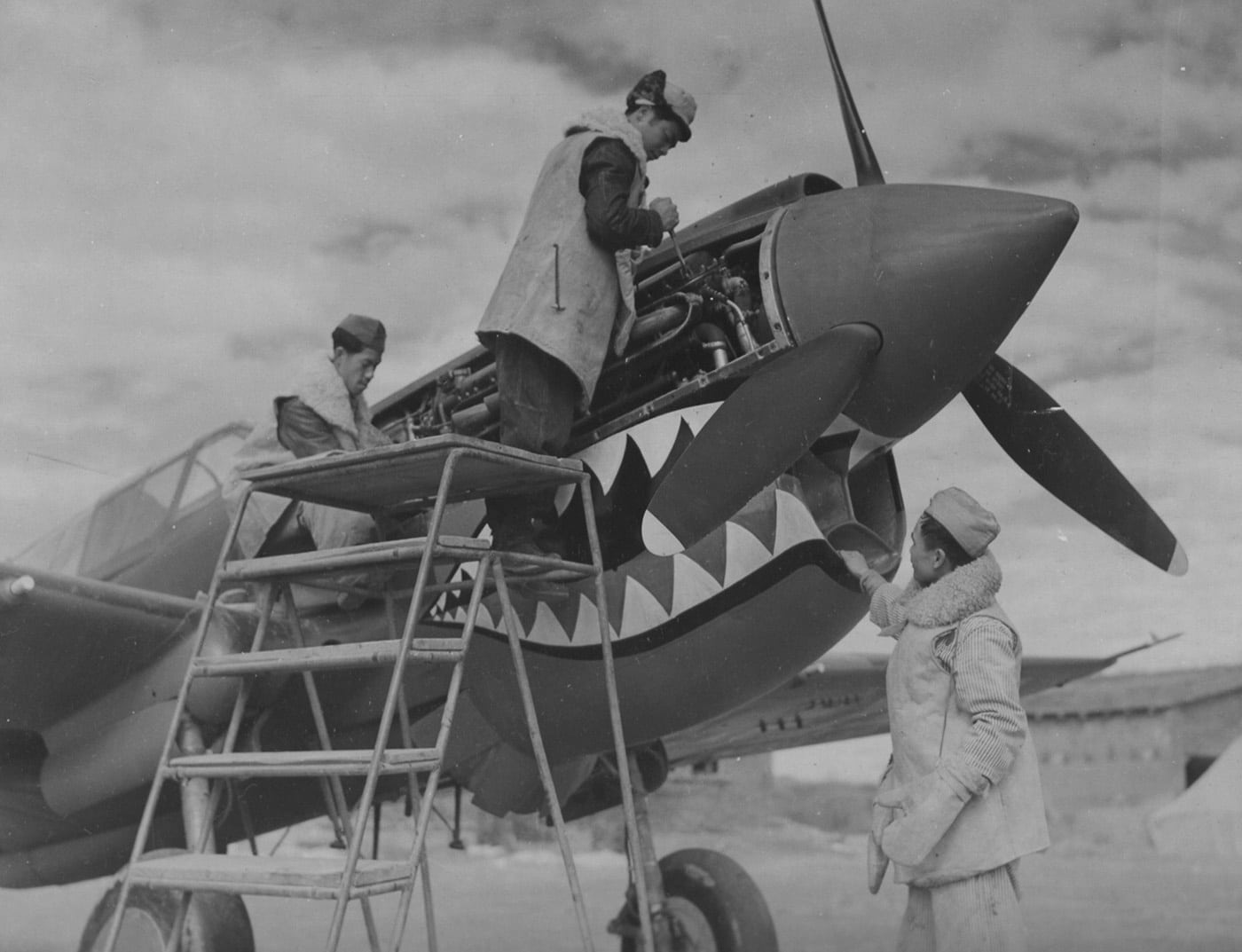 members of the AVG service a P-40 fighter