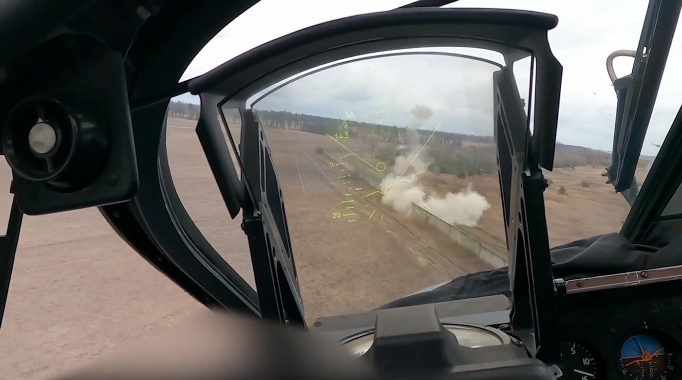 In this unusual photo taken from the interior of a Ka-52, we see the Russian helicopter engaging Ukrainian military forces at the Antonov Airport. Shortly after this image was taken, the Ka-52 and several Mi-8 helicopters were shot down with anti-aircraft missiles. 