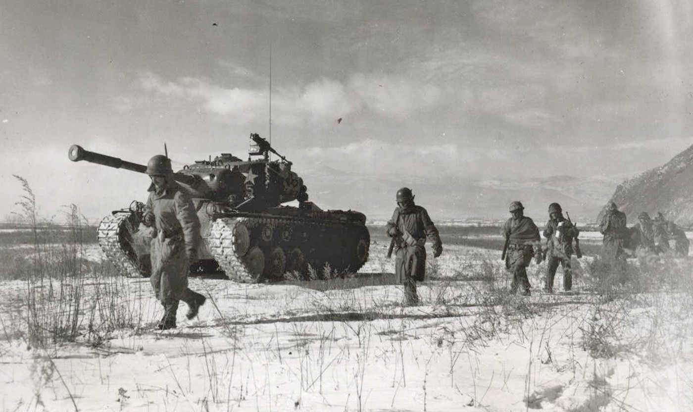 U.S. Marines, both infantry and a M46 Patton tank, move along the south side of Chosin Reservoir. The 5th Marines were left exposed when the Chinese attack hit UN forces. X Corps of the United States Army was tied up east of the 1MarDiv,