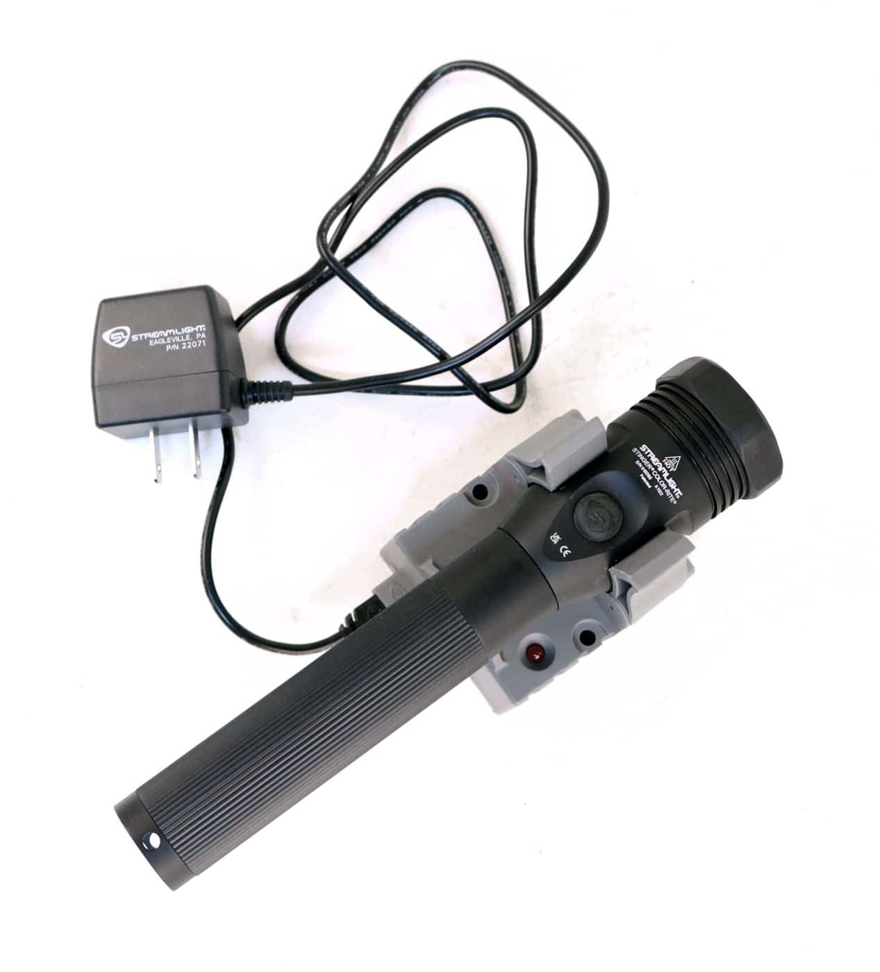 In this digital photograph, we see a Streamlight Stinger Color-Rite flashlight in its charger. As explained in this review, the flashlight ships with the charger.