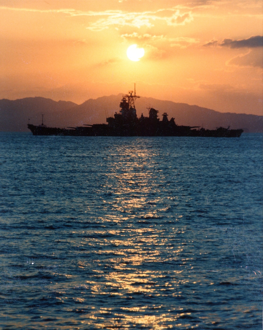 port side view of USS Iowa at sunset Costa Rica
