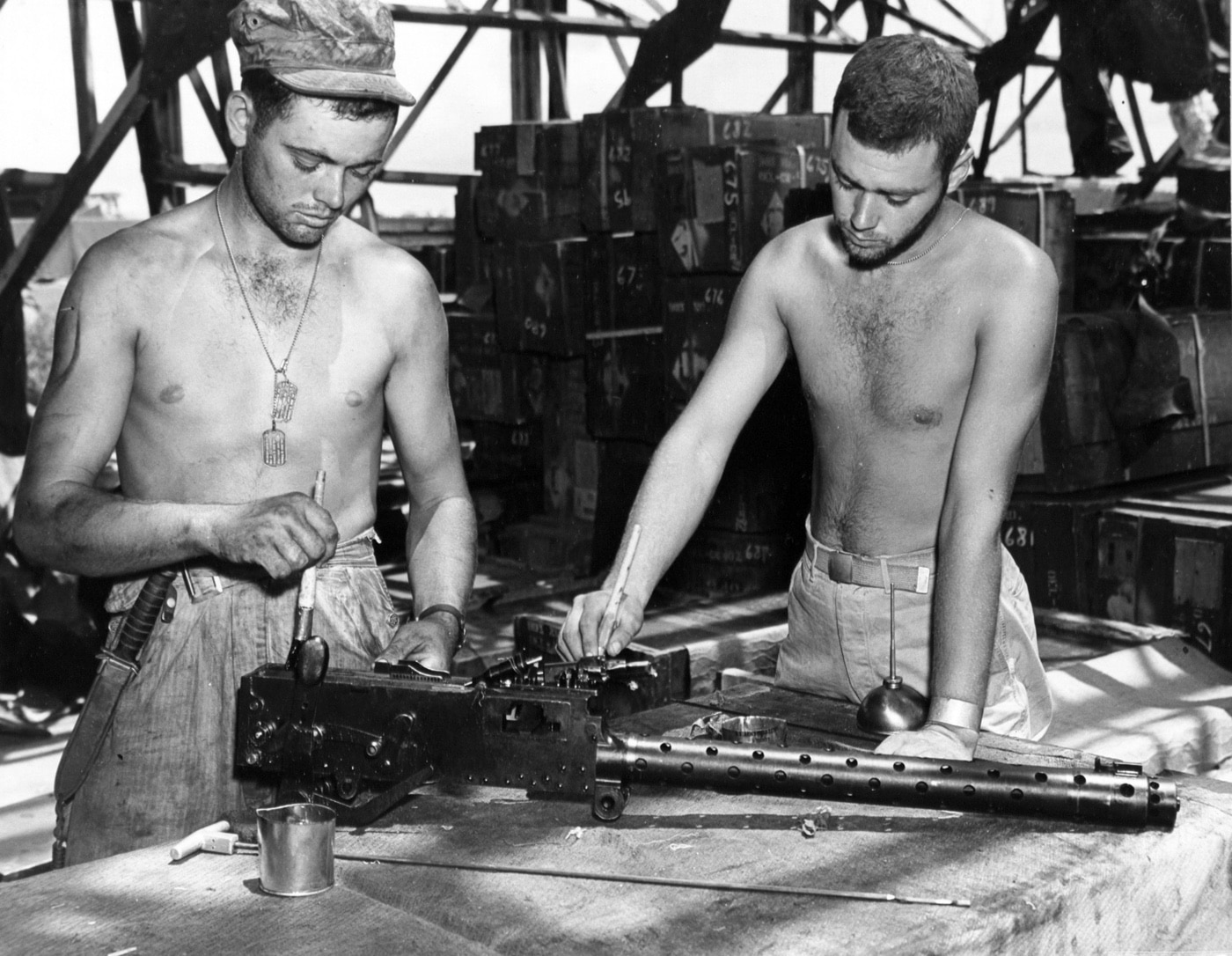 intelligence soldiers examine a captured Japanese Type 97 aircraft machine gun