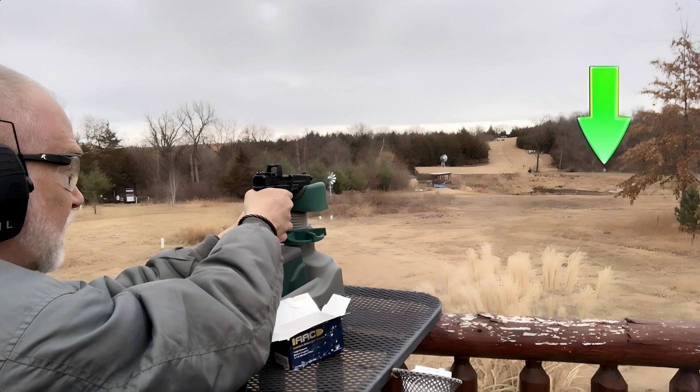 In this photo, the author is shooting at a 200 yard target with his Springfield Armory Echelon pistol. He is testing the gun to determine its maximum range.