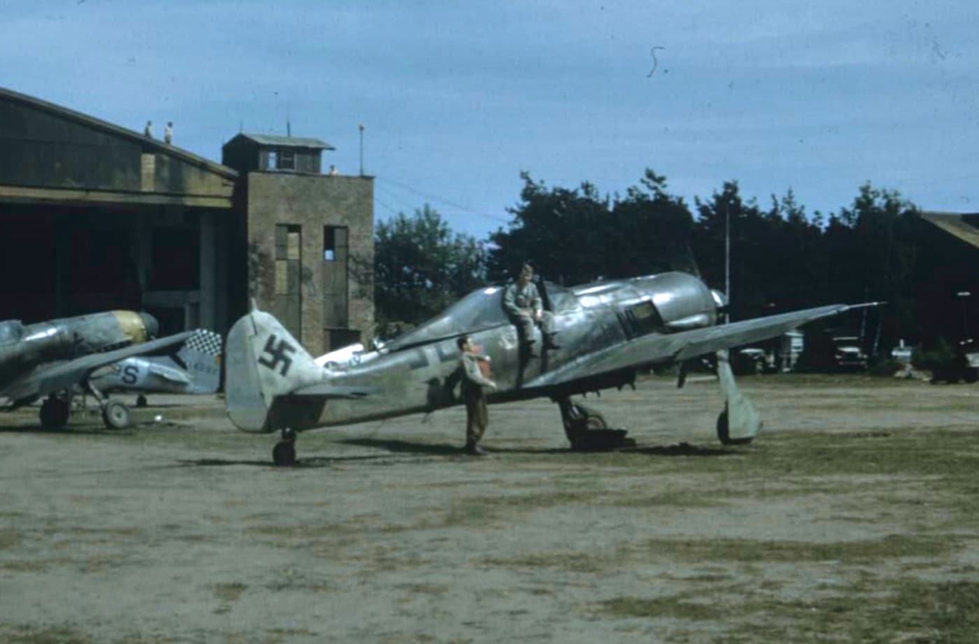 US Army soldiers inspect a Fw 190 fighter during World War II