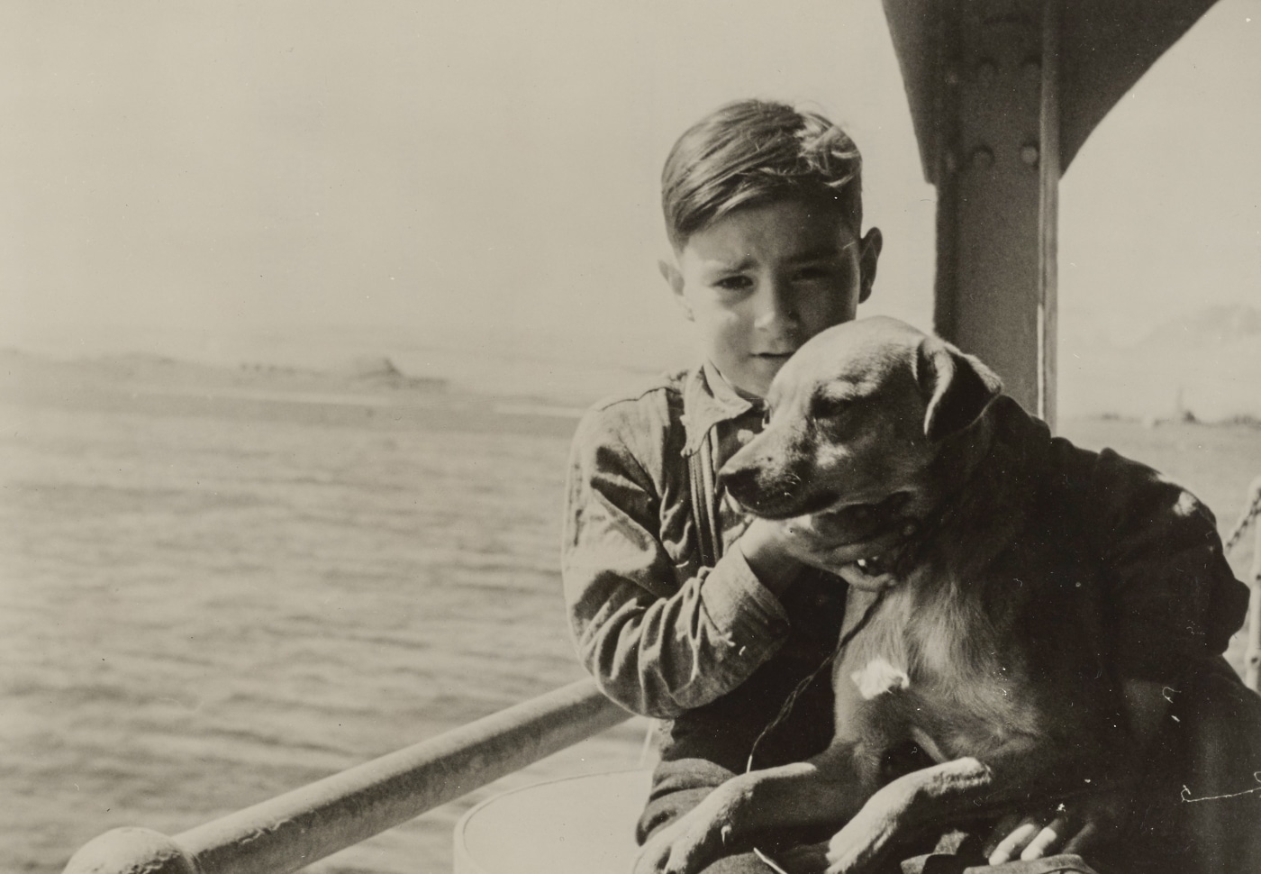 Aleut child and dog are repatriated to the islands after the war