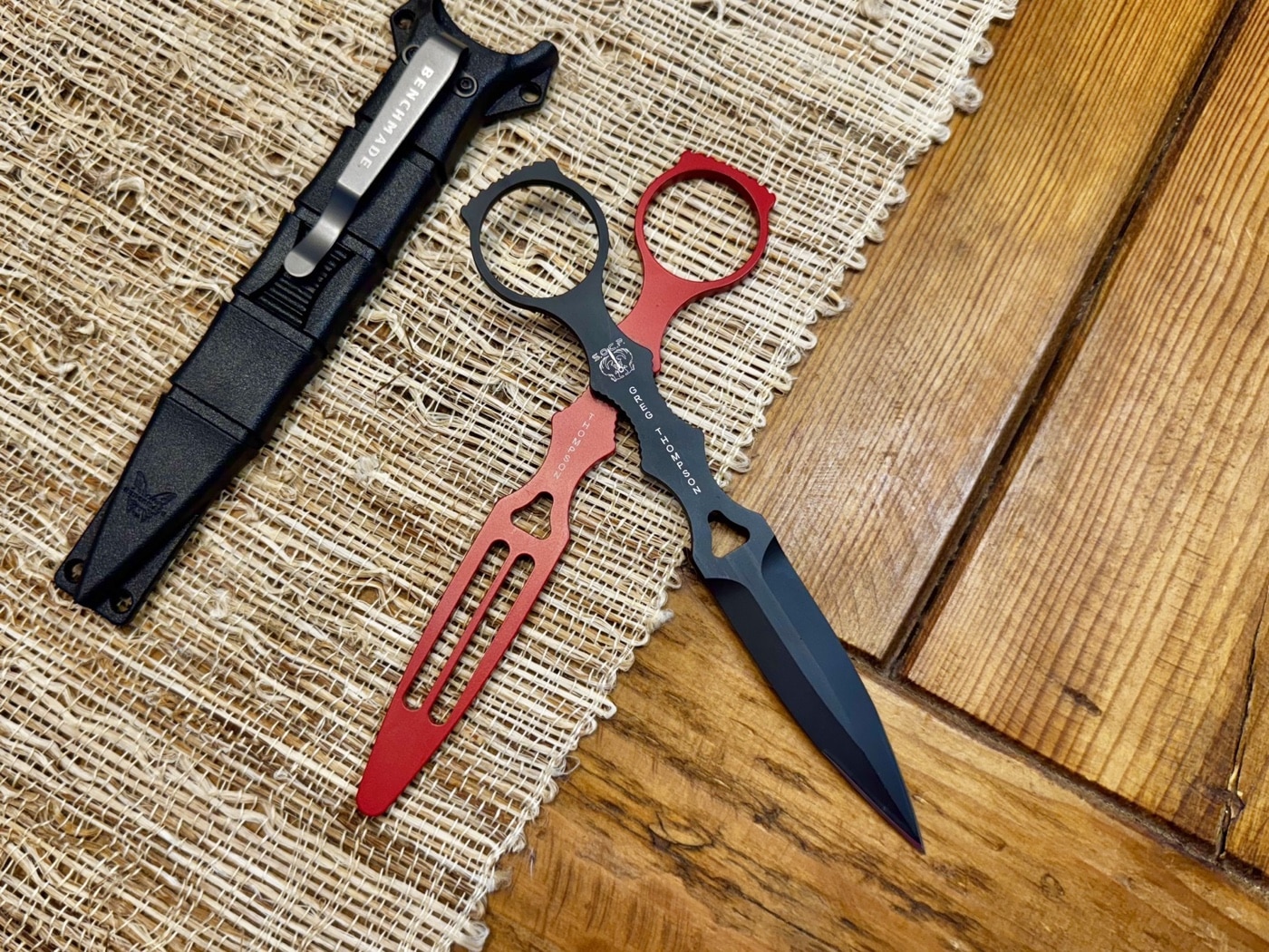 The photo zooms in on the handle area of the Benchmade SOCP dagger, highlighting the scalloped grooves and circular retention ring. These features replace traditional handle scales to keep the knife slim and wearable under armor. The jimping on the ring’s thumb shelf provides traction for thrusting. You can see how this stripped-down frame is made for use with gloves. Nothing flashy — just practical form following function. It’s a combat knife, not a camp tool.
