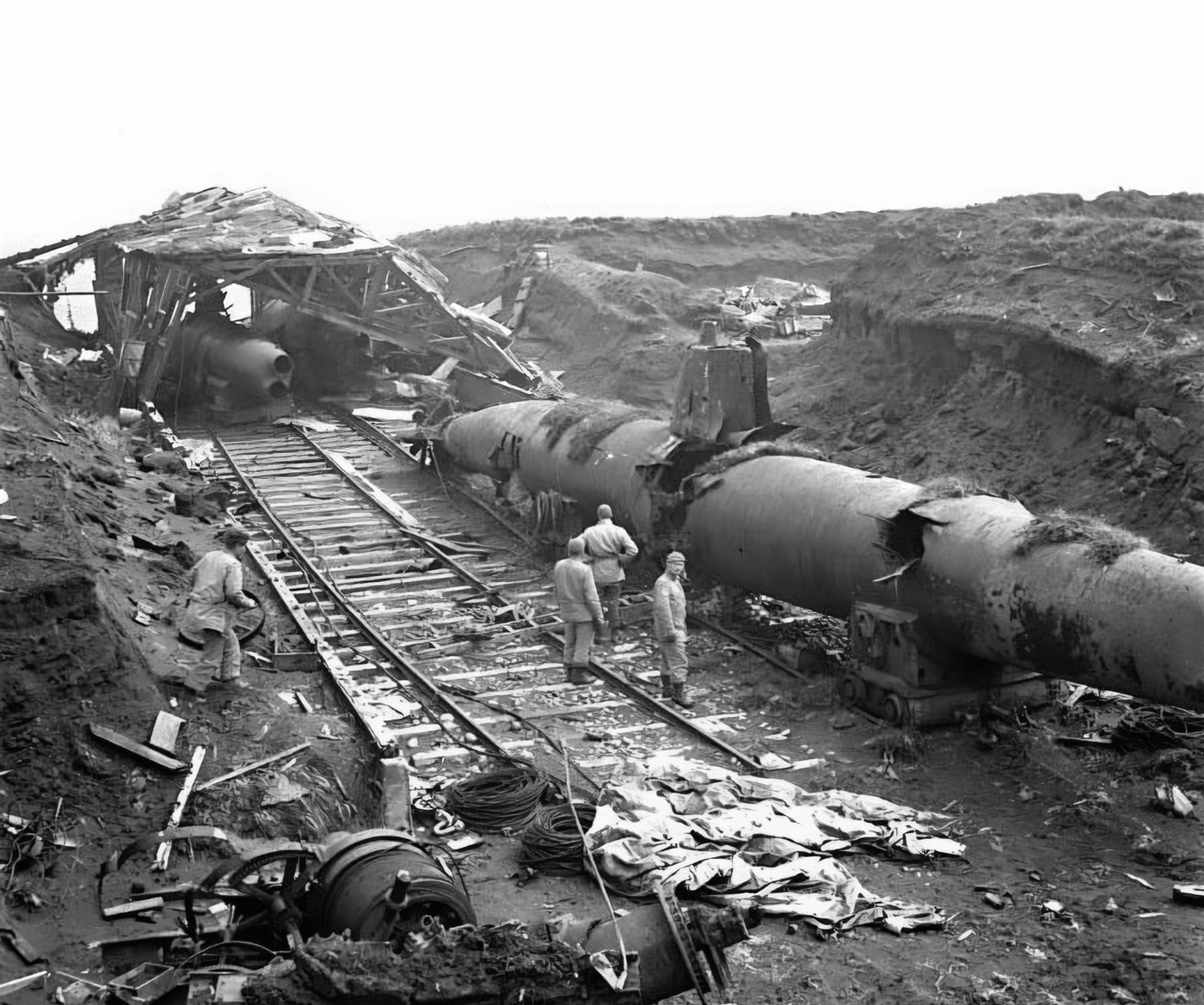 Canadian and US troops examine captured Japanese submarines on Kiska Island