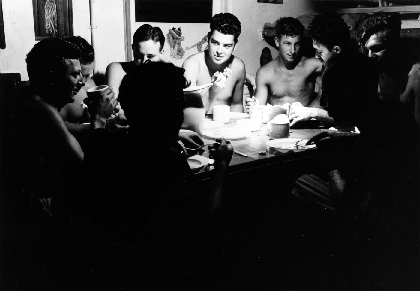 PT crew dines in informal attire without shirts in South Pacific