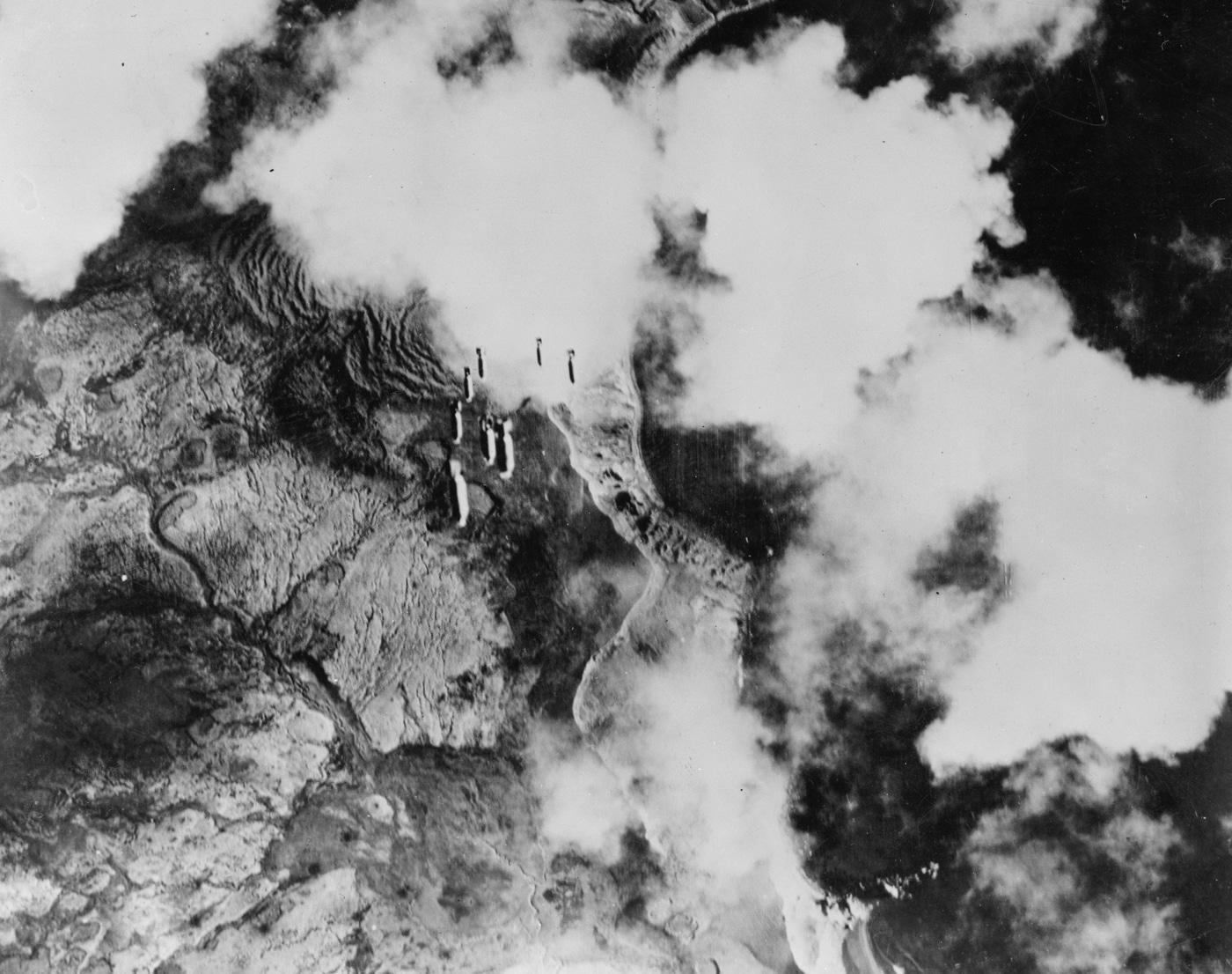 US Army Air Force bombers drop payload on Japanese positions on Kiska Island
