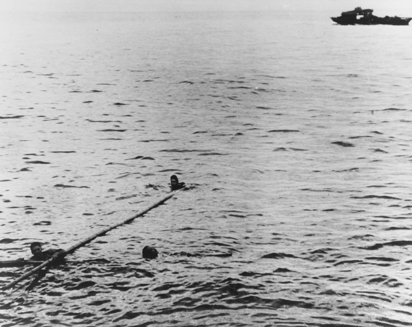 USS Drum rescues two Japanese sailors after sinking their ship