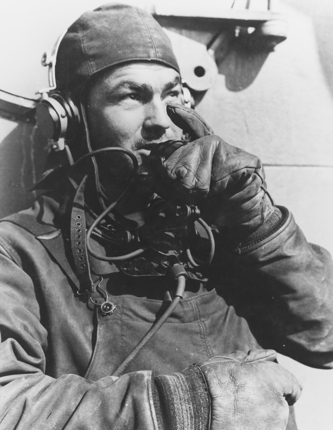 sailor operating sound powered telephone on USS Salt Lake City