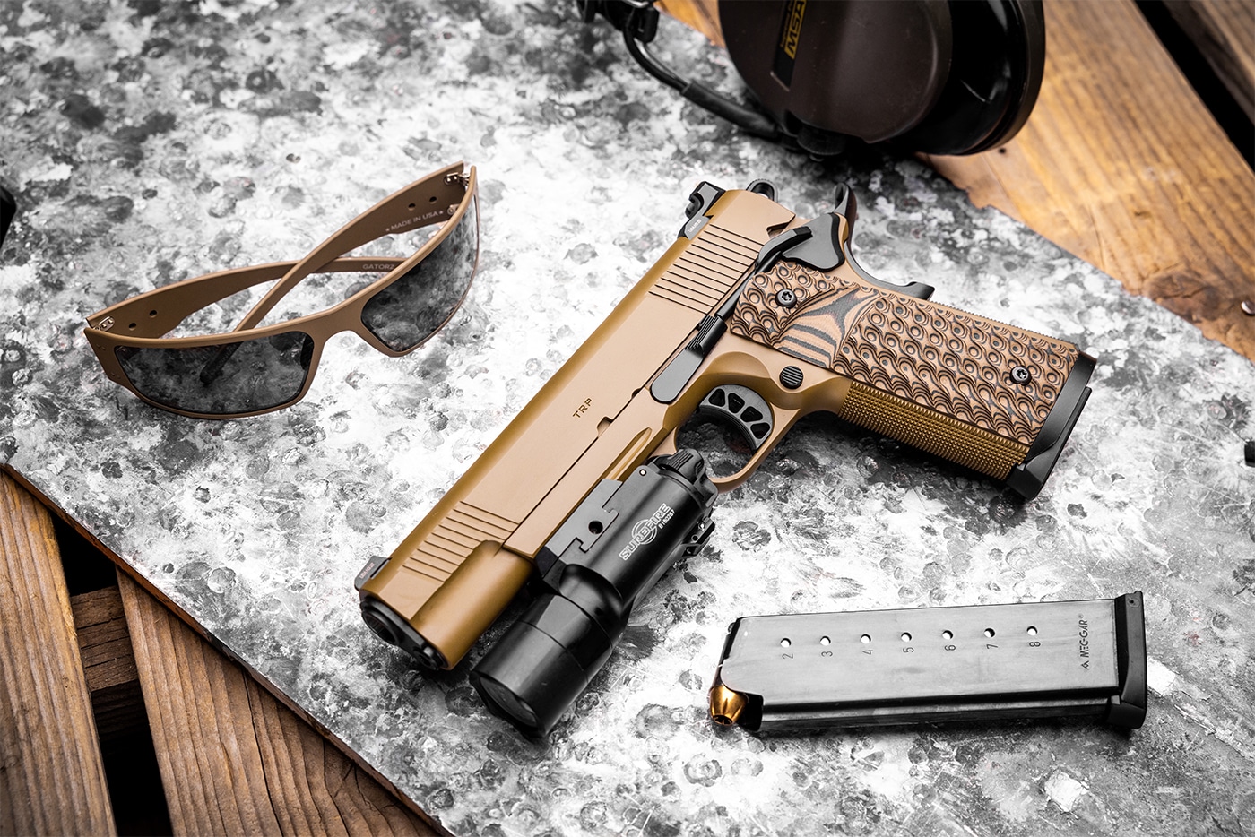 The image shows a Springfield TRP 1911 pistol chambered in .45 ACP. Known for its robust construction, the TRP model is equipped with features like tactical rail and adjustable sights, enhancing its performance capabilities. The .45 ACP caliber is traditionally favored for its stopping power, contributing to the ongoing debate between larger calibers and smaller counterparts like the 9mm. The TRP's design emphasizes reliability and precision, making it popular among enthusiasts and professionals. This model exemplifies the enduring appeal of the 1911 platform in self-defense applications. It is often compared with smaller calibers to assess efficiency and power balance.