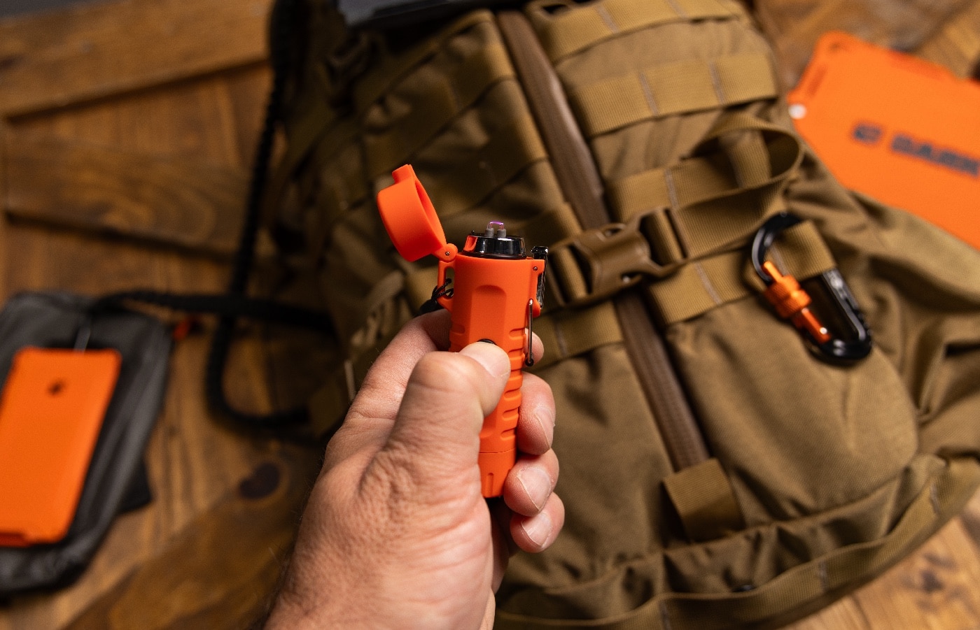 Dark Energy review presents the rechargeable plasma lighter and flashlight held in hand, emitting a bright light beam. The dual-arc plasma torch tips and USB charging port are visible beneath the flashlight head. You can see the strobe feature indicator etched on the side. It’s a windproof, fuel-free ignition and emergency light tool built for off-grid survival in this Dark Energy review. The photo highlights compact fire-starting and lighting capability.