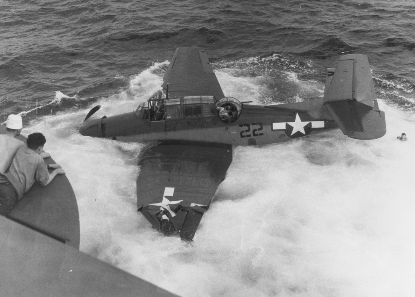 Grumman TBF-1C Avenger ditches in water next to USS Coral Sea CVE-57