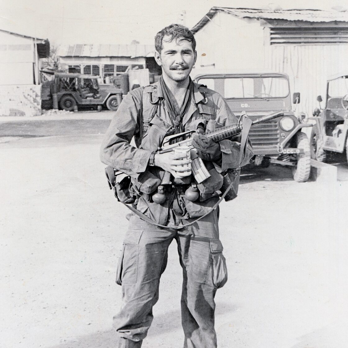 Major John Plaster after an ambush in Vietnam War with CAR-15 and Budweiser beer