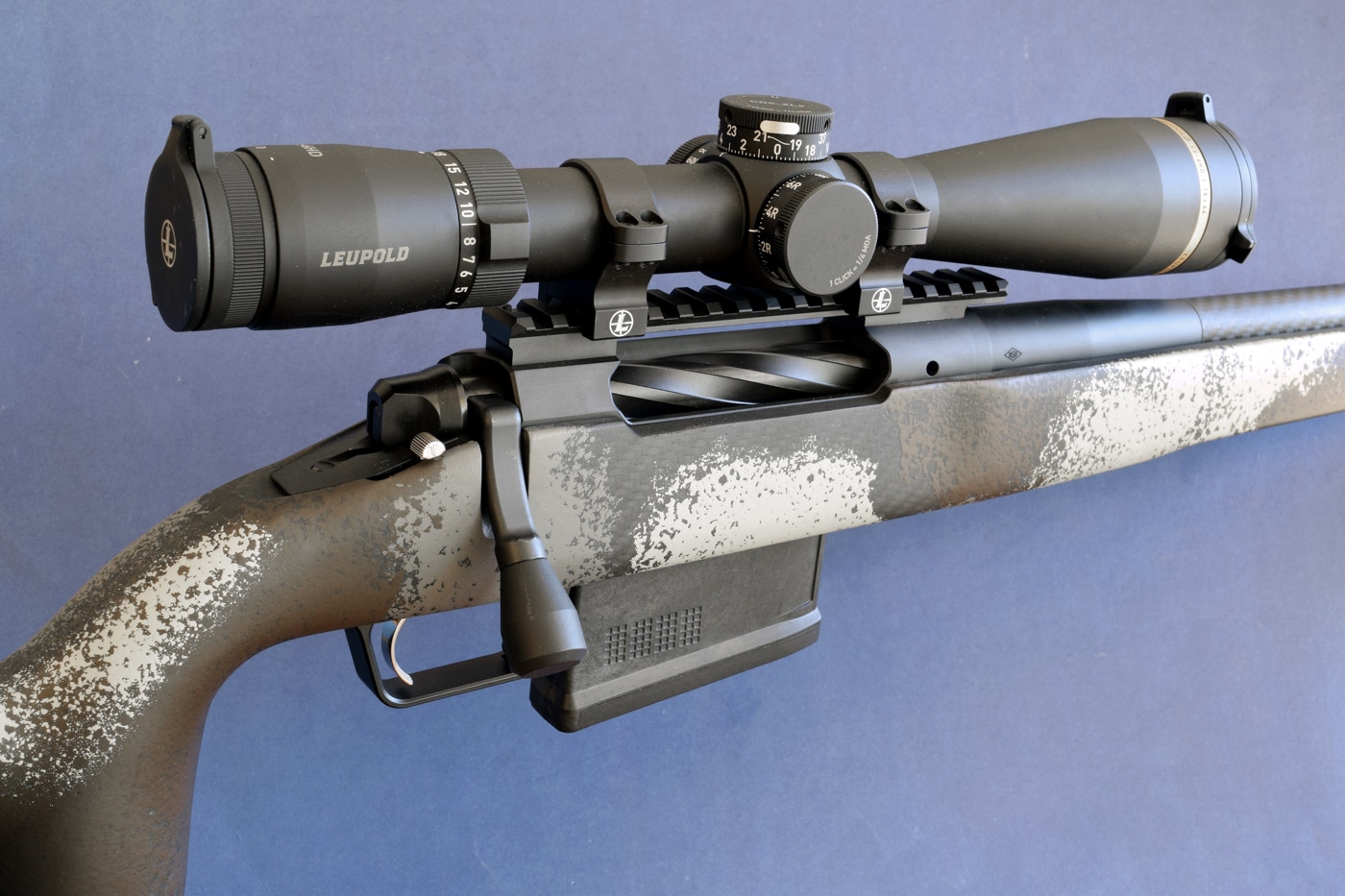The Springfield Armory Model 2020 Waypoint is shown chambered in .270 Winchester with a Leupold scope mounted on its fluted carbon-fiber barrel. The ergonomic stock features pillar bedding and M-Lok slots under the fore-end. Its Radial Brake muzzle device and threaded barrel hint at reduced recoil and thermal stability during extended strings of fire. The Leupold optic’s exposed turrets and large objective lend themselves to precise windage and elevation adjustments at long range. This bolt-action rifle’s twin-lug action and smooth feed ramp underscore reliable cycling and consistent shot placement. With its flat-shooting trajectory and high ballistic coefficient, the .270 Winchester cartridge delivers consistent downrange energy and big-game performance. The blend of modern components and century-old cartridge heritage highlights the enduring reputation for sectional density and velocity of this medium-game cartridge.
