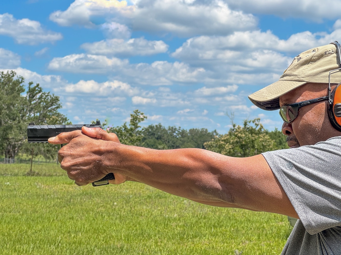 man shoots a Springfield Emissary on the shooting range