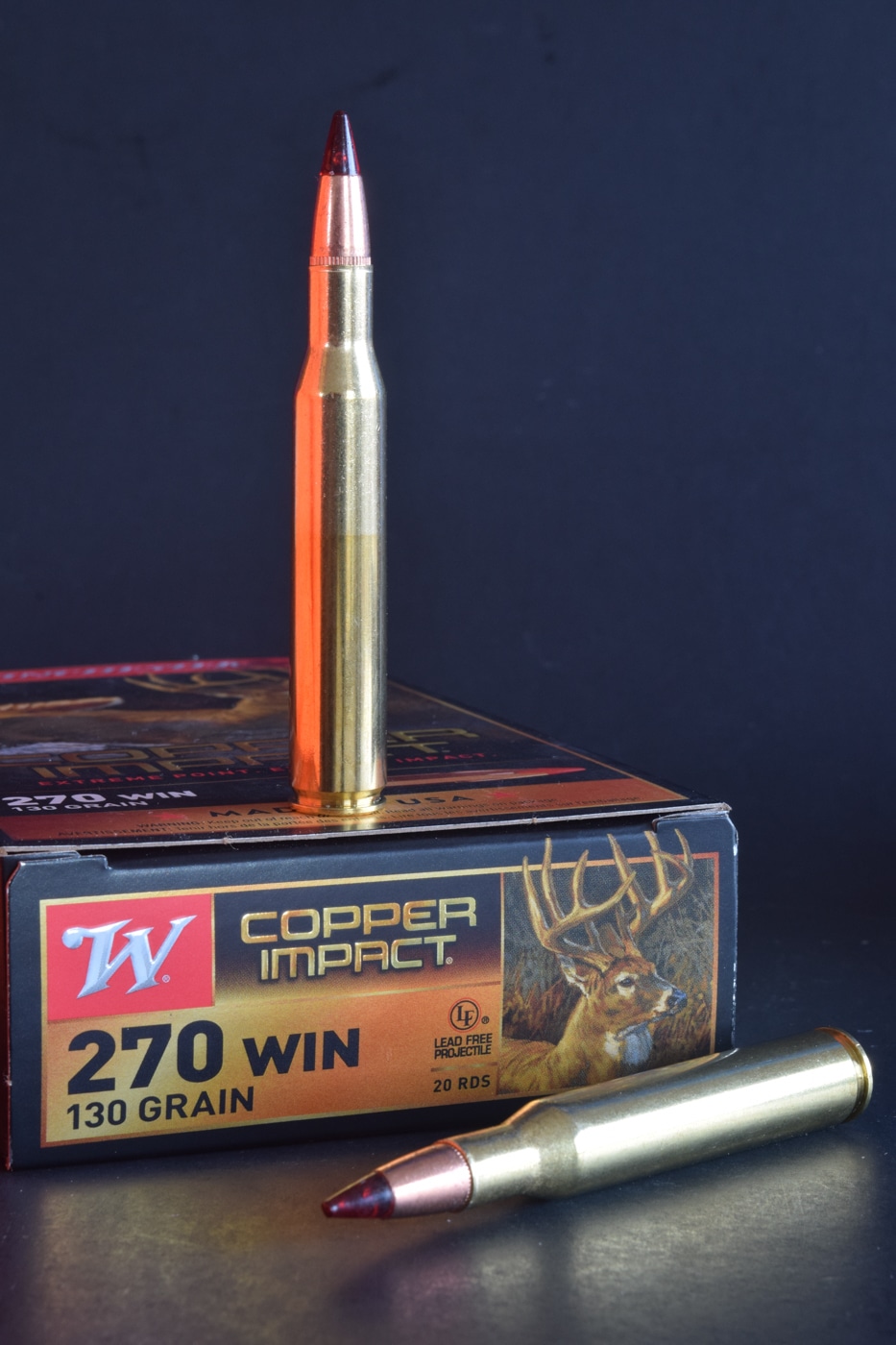 Close-up of a modern 130-grain Copper Impact load from Winchester Ammunition seated in a .270 Winchester case. The polymer-tipped bullet aligns perfectly with the necked-down brass, hinting at flat-shooting precision. A sleek ogive promises a high ballistic coefficient for consistent long-range accuracy. You can almost sense the controlled expansion and deep penetration through its high sectional density. Necked down from the .30-06 Springfield parent case, it carries a century of cartridge heritage. Recoil stays mild, letting the shooter follow up shots with ease. This hunting-grade load showcases the .270 Winchester’s reputation for downrange energy retention and precise shot placement.