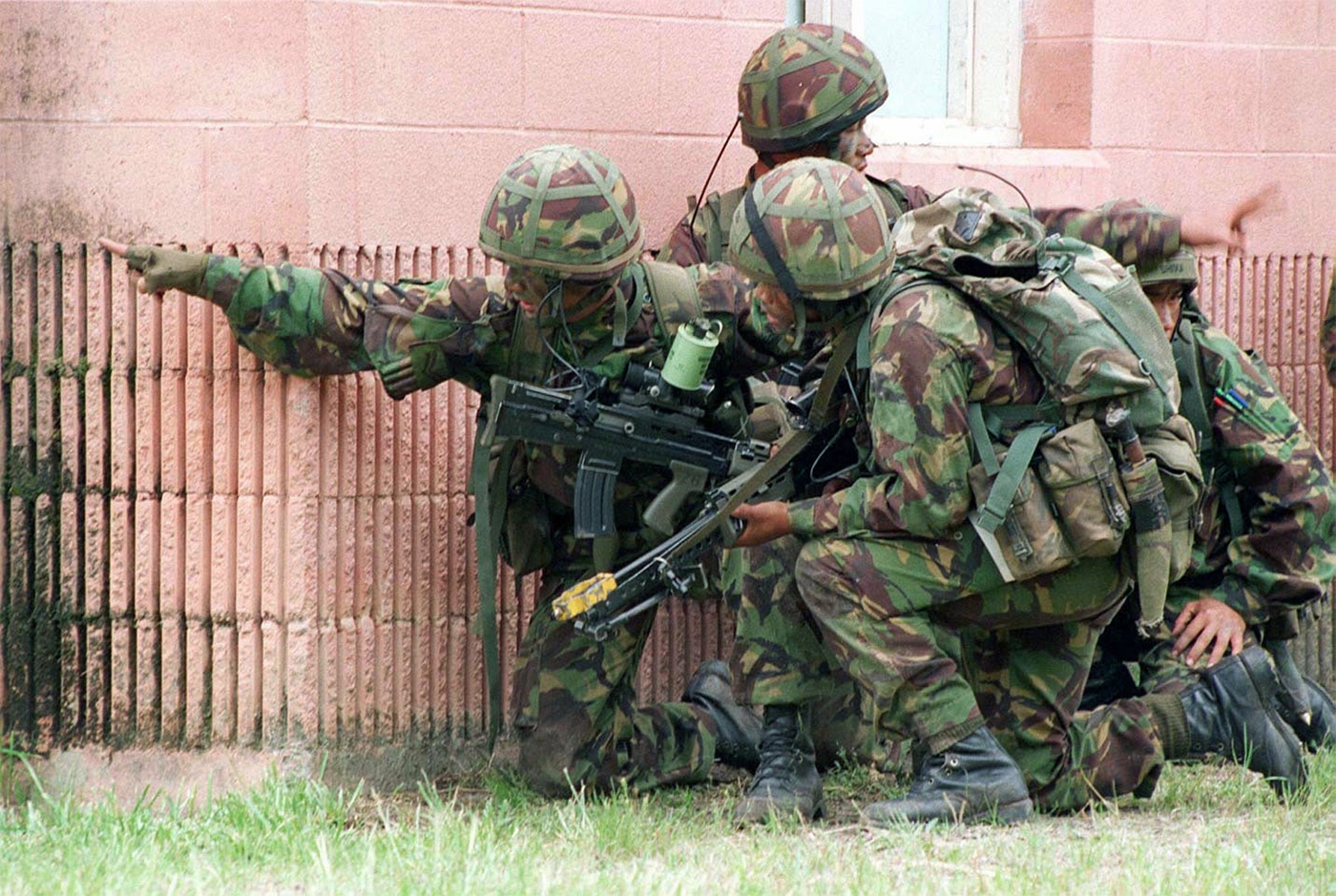 soldiers of the Royal Gurkha Rifles prepare to enter a building held by US Marines in a 1996 training exercise