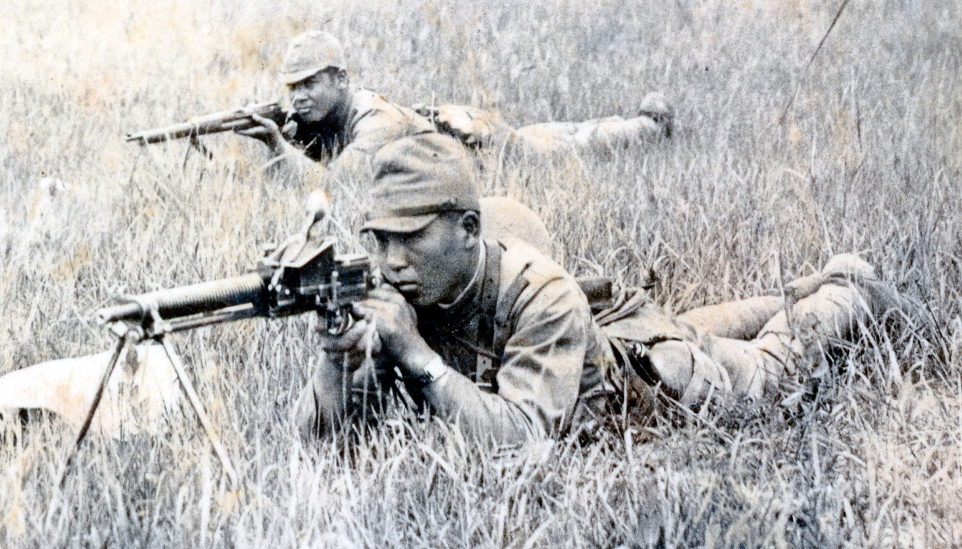 Japanese soldier firing Type 11 machine gun during war in China
