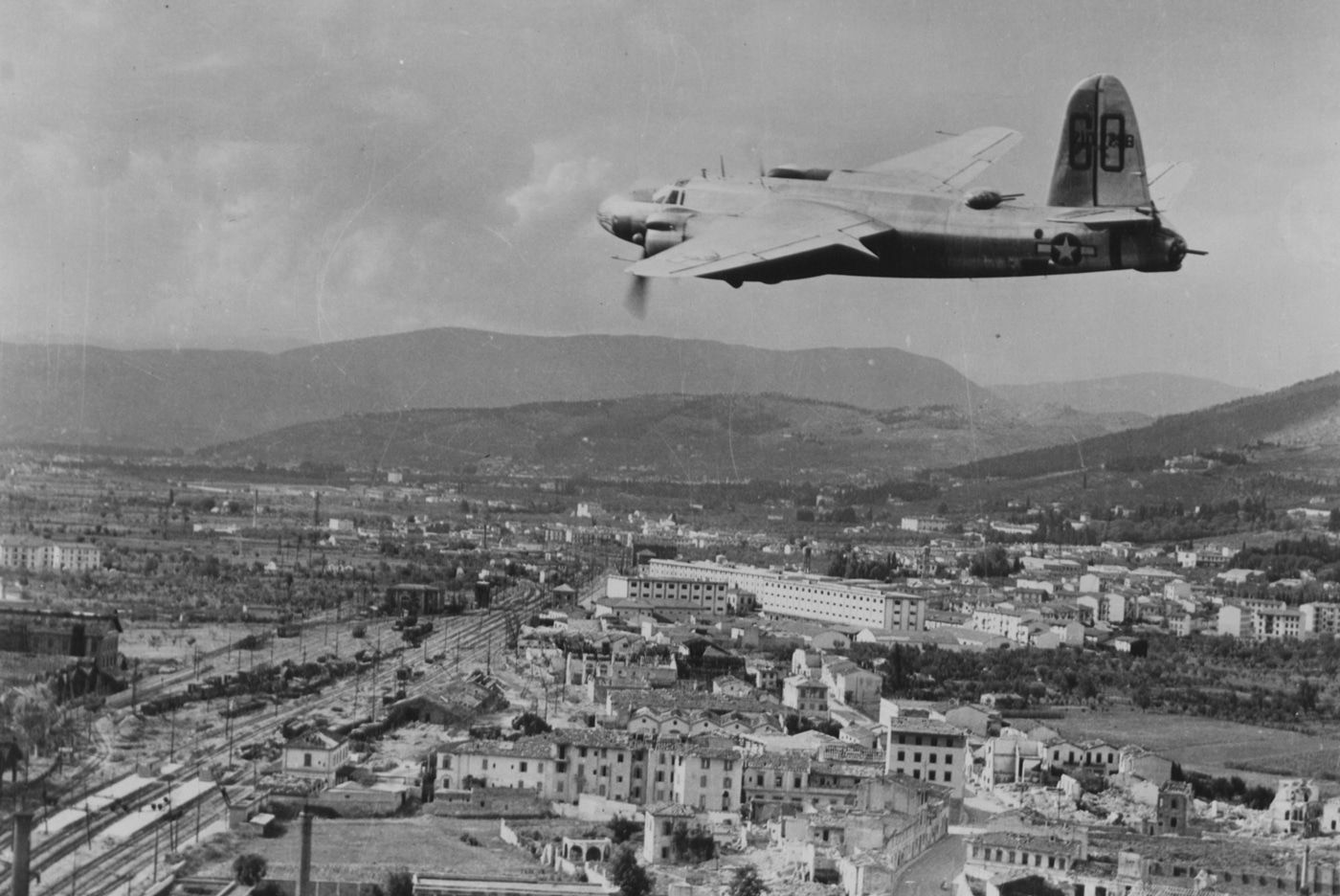 Martin B-26 Marauder bomber flies low over Florence Italy in World War II