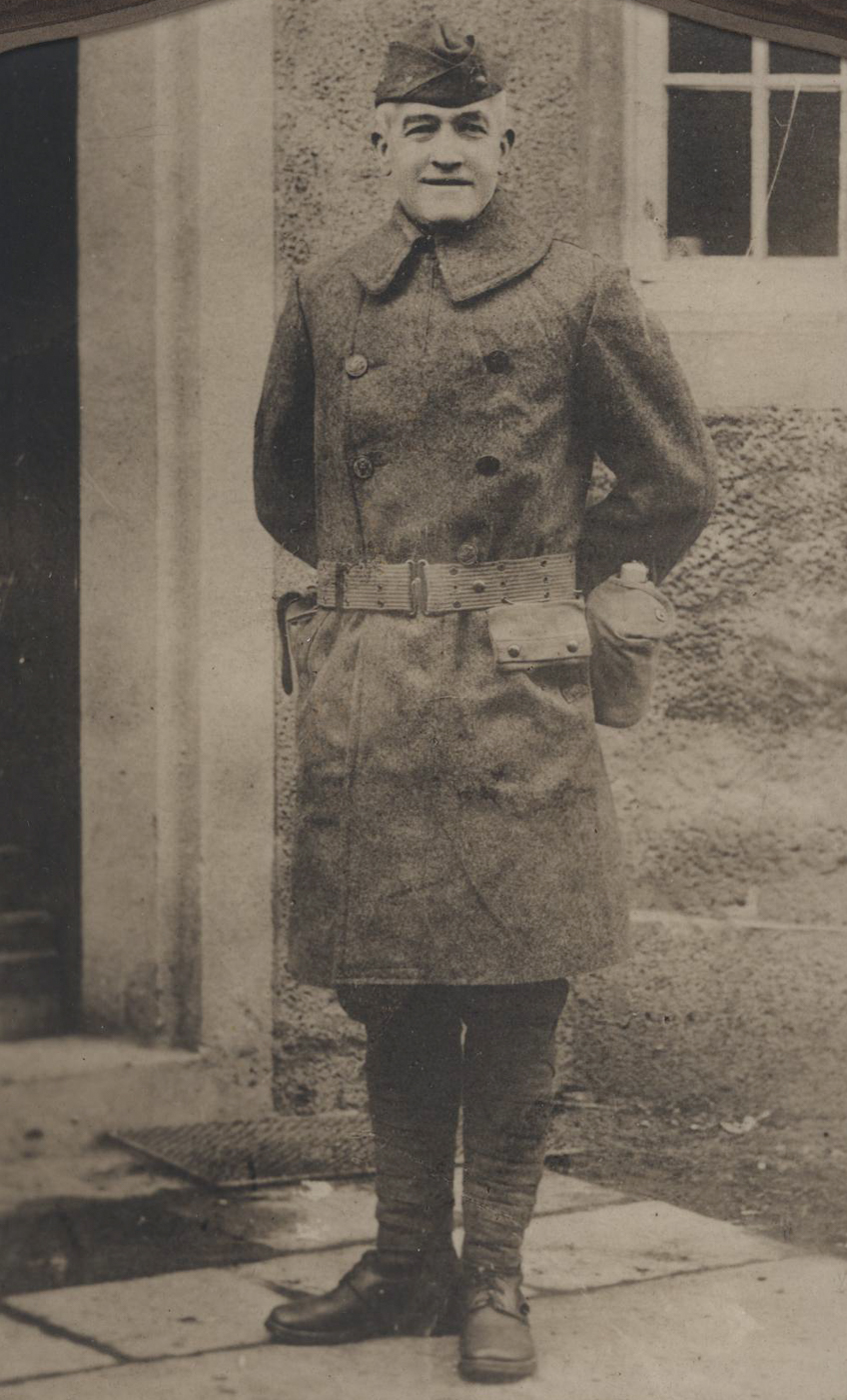 A formal portrait of Sergeant Major Daniel Daly, photographed many years after his participation in the Boxer Rebellion. Daly is shown in full dress uniform, decorated with several medals and ribbons that represent his distinguished Marine Corps career. His face is mature, marked by deep lines and a resolute expression that reflects years of military service. The photograph is likely black and white or sepia-toned, common for portraits from the early to mid-20th century. Daly’s posture is upright and disciplined, emphasizing his reputation for toughness and leadership. Visible on his chest is at least one Medal of Honor, with other awards signifying later service. This image highlights Daly’s enduring status as a Marine Corps legend and his lasting impact on American military history. The photo provides a sense of dignity and respect for one of the most celebrated Marines of his era.