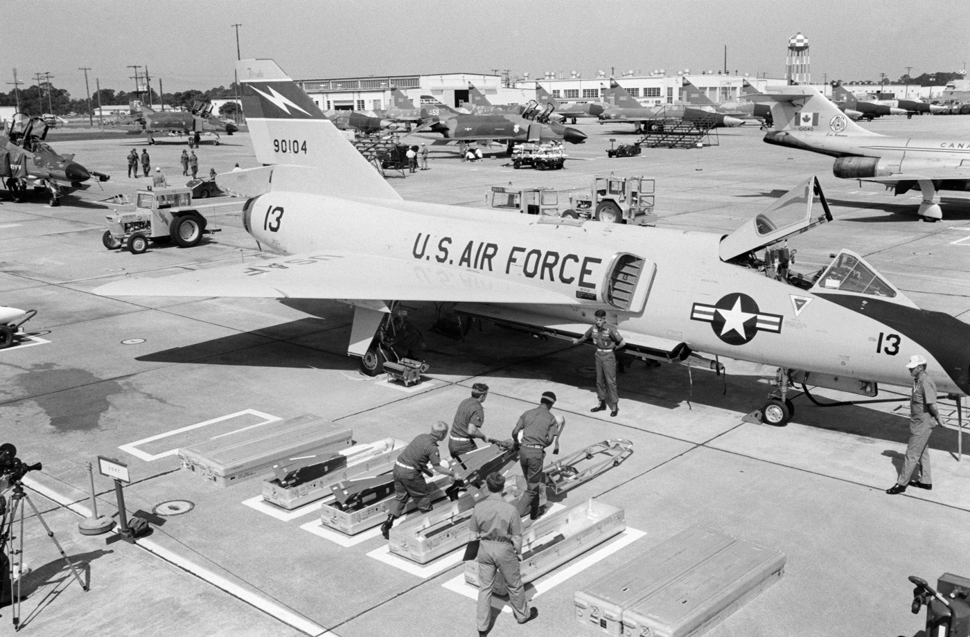 crew loads AIM-4G Super Falcon missile on F-106 Delta Dart