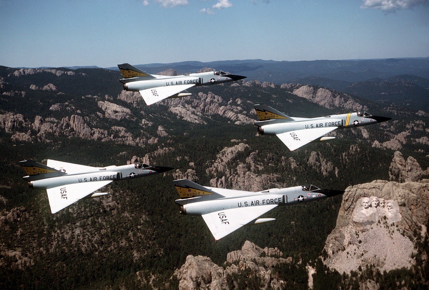four F-106 Delta Dart interceptors over Mount Rushmore