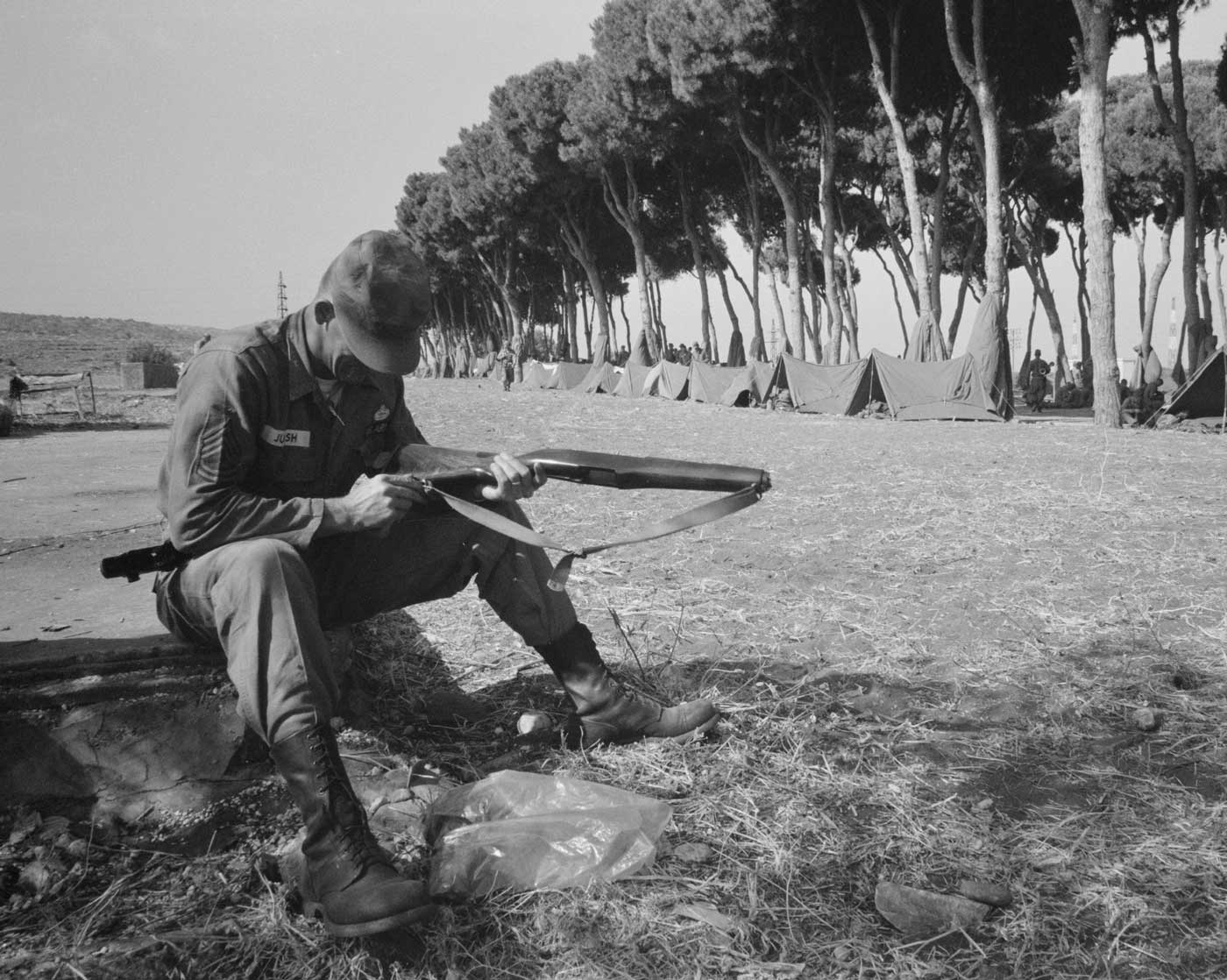 American paratrooper cleans his rifle in Beirut Lebanon