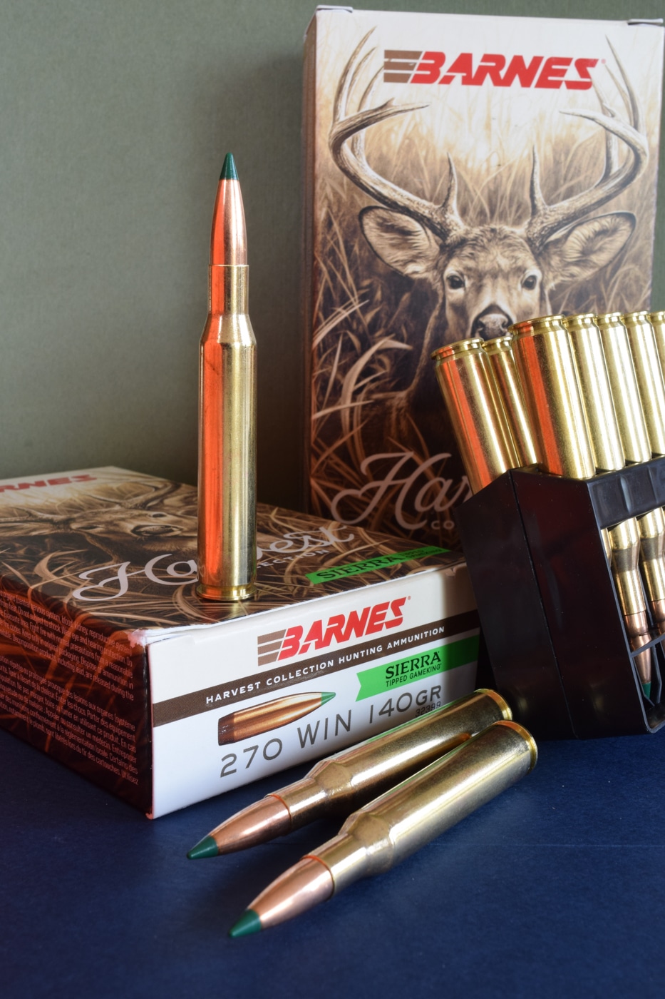 Close-up shot of a Springfield Armory 2020 Waypoint used in ballistic testing for the Barnes Harvest Collection .270 load. The rifle is fitted with a high-magnification optic and sits securely on a sandbag rest. The stock has a modern camo pattern, and the barrel is lightweight carbon fiber. Testing revealed an average muzzle velocity of 2,900 fps with excellent consistency. The image highlights the test setup and rifle configuration used for accuracy evaluation.