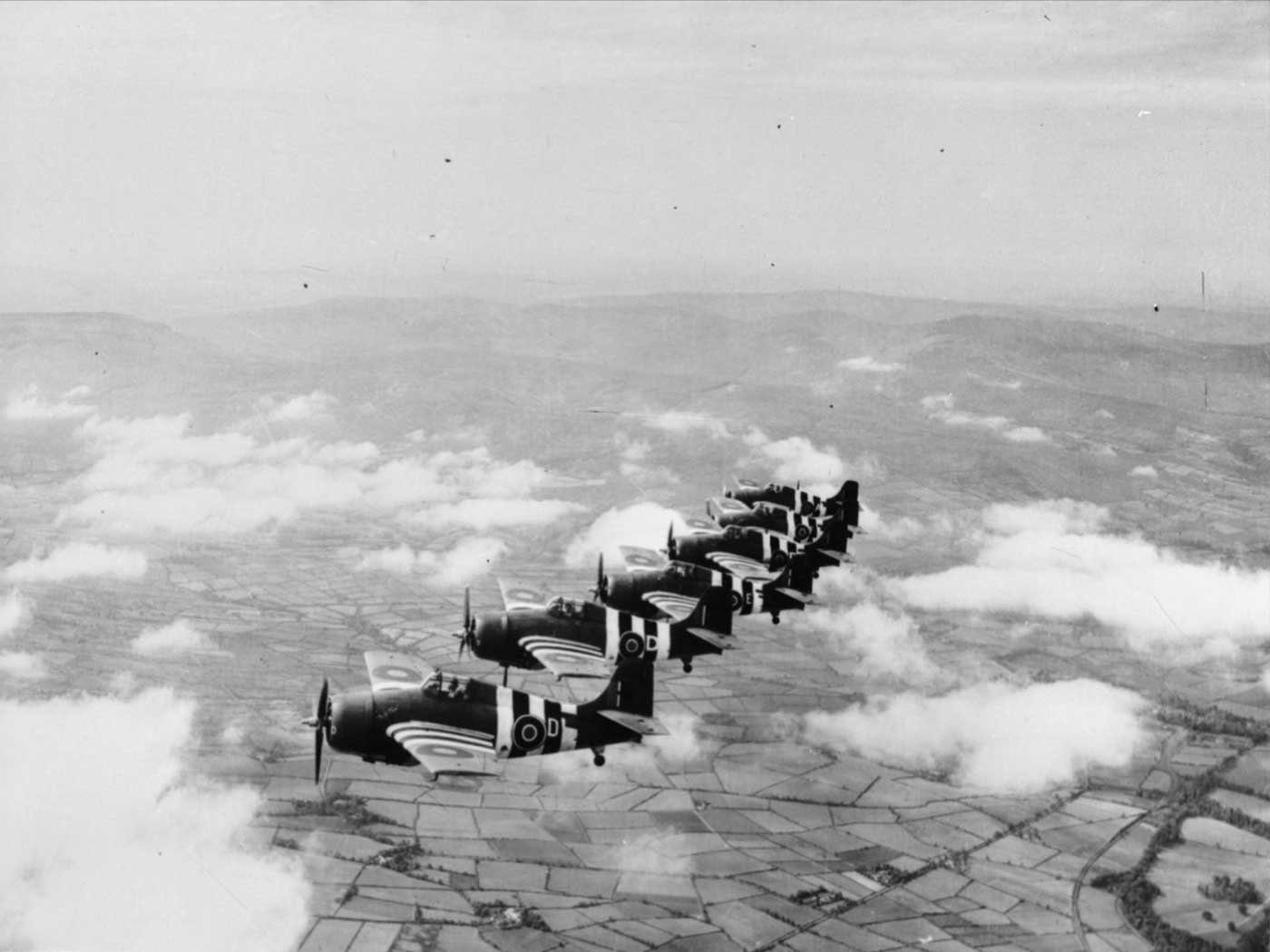 Royal Navy Grumman Martlet fighters fly in formation over Northern Ireland