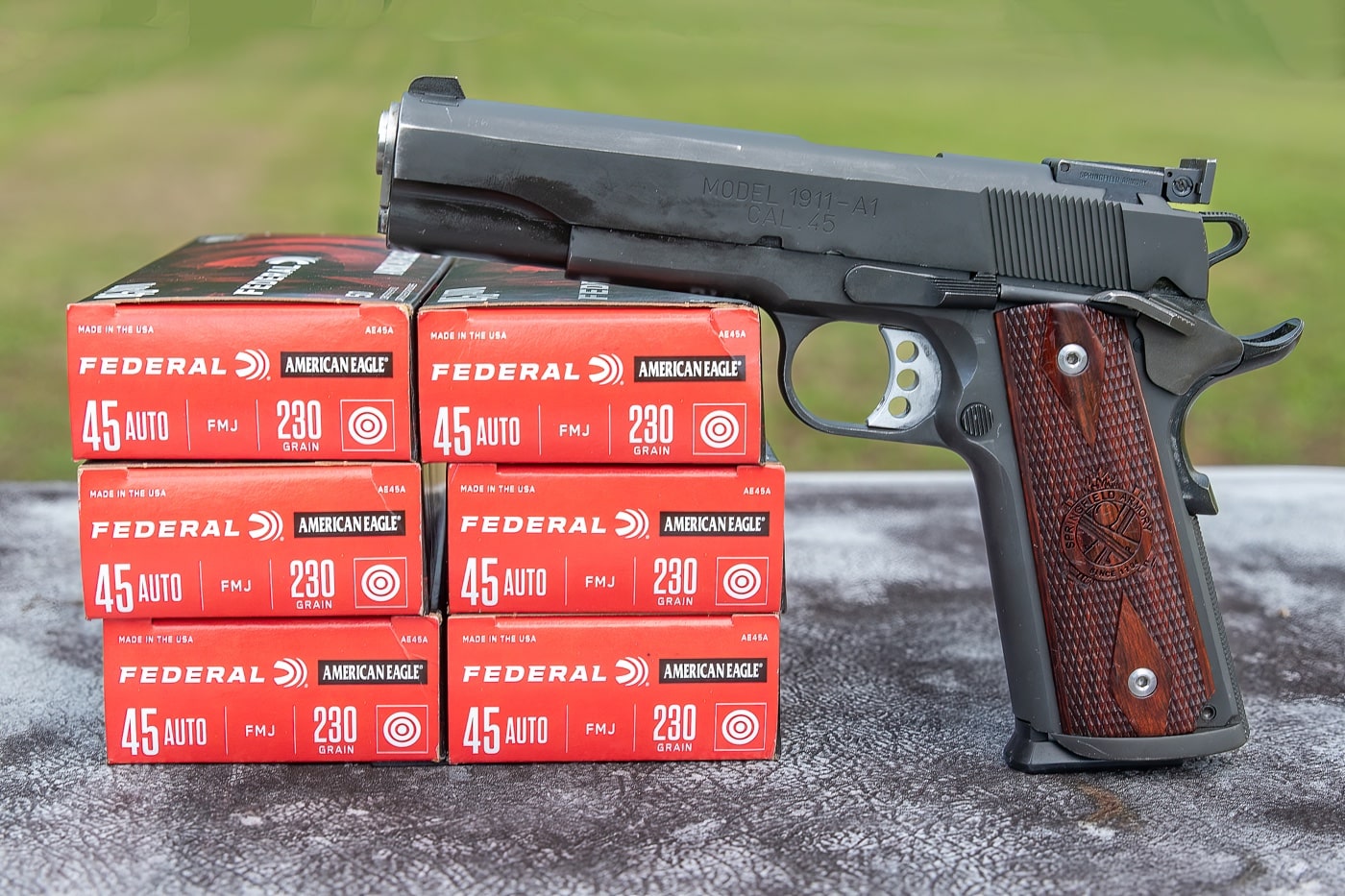 This photo features a Springfield Armory Range Officer 1911 pistol displayed with Federal .45 ACP ammunition. The handgun is positioned to showcase its classic 1911 styling, including the checkered grips, extended beavertail, and government-size frame. Several .45 ACP cartridges are visible beside the pistol, emphasizing the traditional caliber long associated with the platform. The Range Officer line is known for durability, accuracy, and performance suited for competition and defensive use. The .45 ACP ammunition represents the cartridge’s stopping power and enduring role in American handgun history. Together, the pistol and ammunition highlight a combination designed to last a lifetime. The clean layout reinforces the idea of reliability and precision.