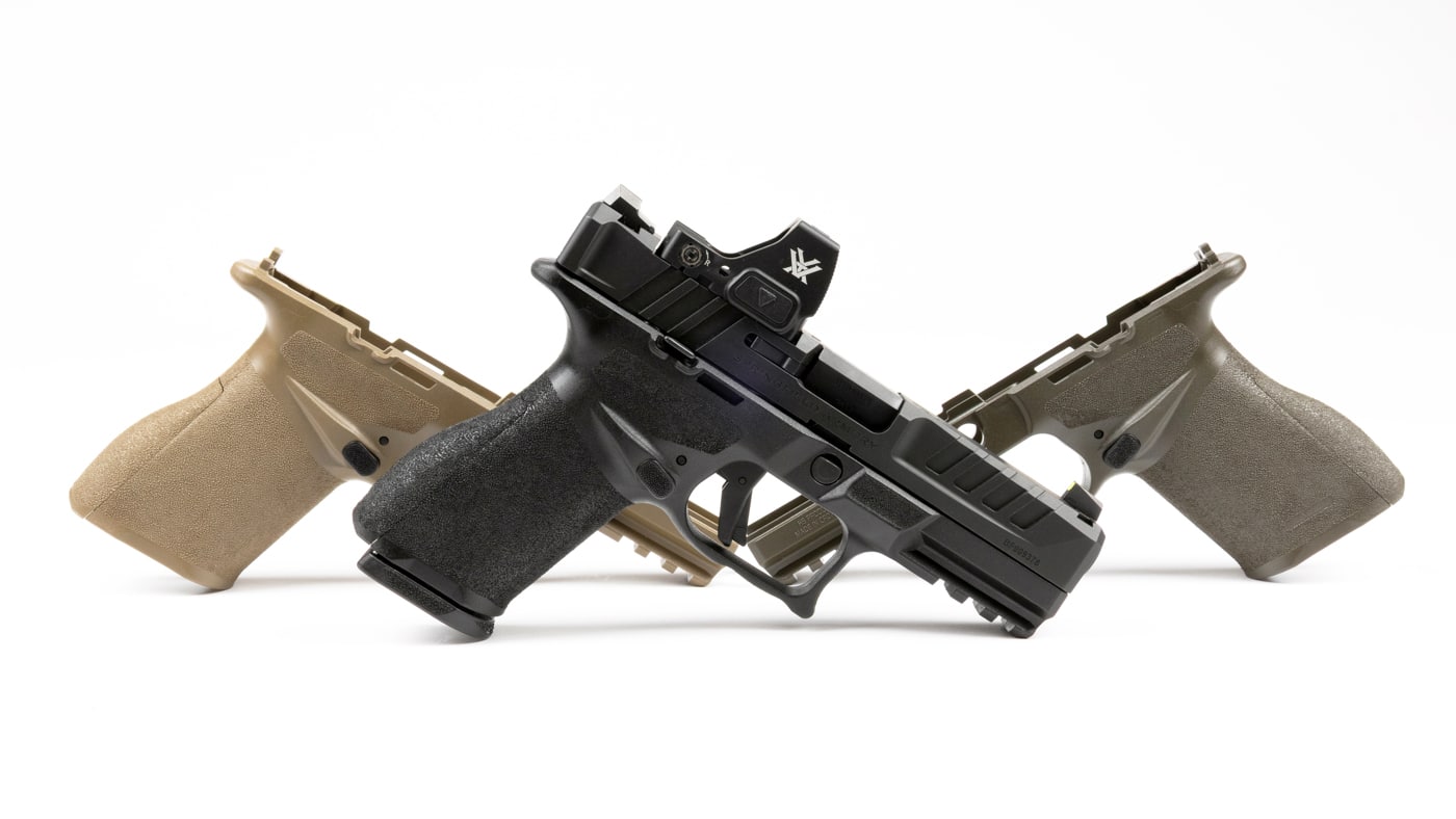 The image shows all three sizes of Springfield Echelon 4.0C factory grip modules displayed side by side on a flat surface. The grips are made of polymer and are designed for the Echelon 4.0C model, each one featuring an integrated magazine release. They differ in overall width and length to accommodate small, medium, and large hand sizes, giving shooters flexibility in fit and ergonomics. Each grip has textured surfaces to enhance control and reduce slippage during shooting. The Springfield Armory logo is visible on each module, confirming they are official factory parts. These grips are shown in their standard black color, but FDE and OD Green options are also available. The photo is well-lit and clearly displays the differences in size among the three factory grip modules.