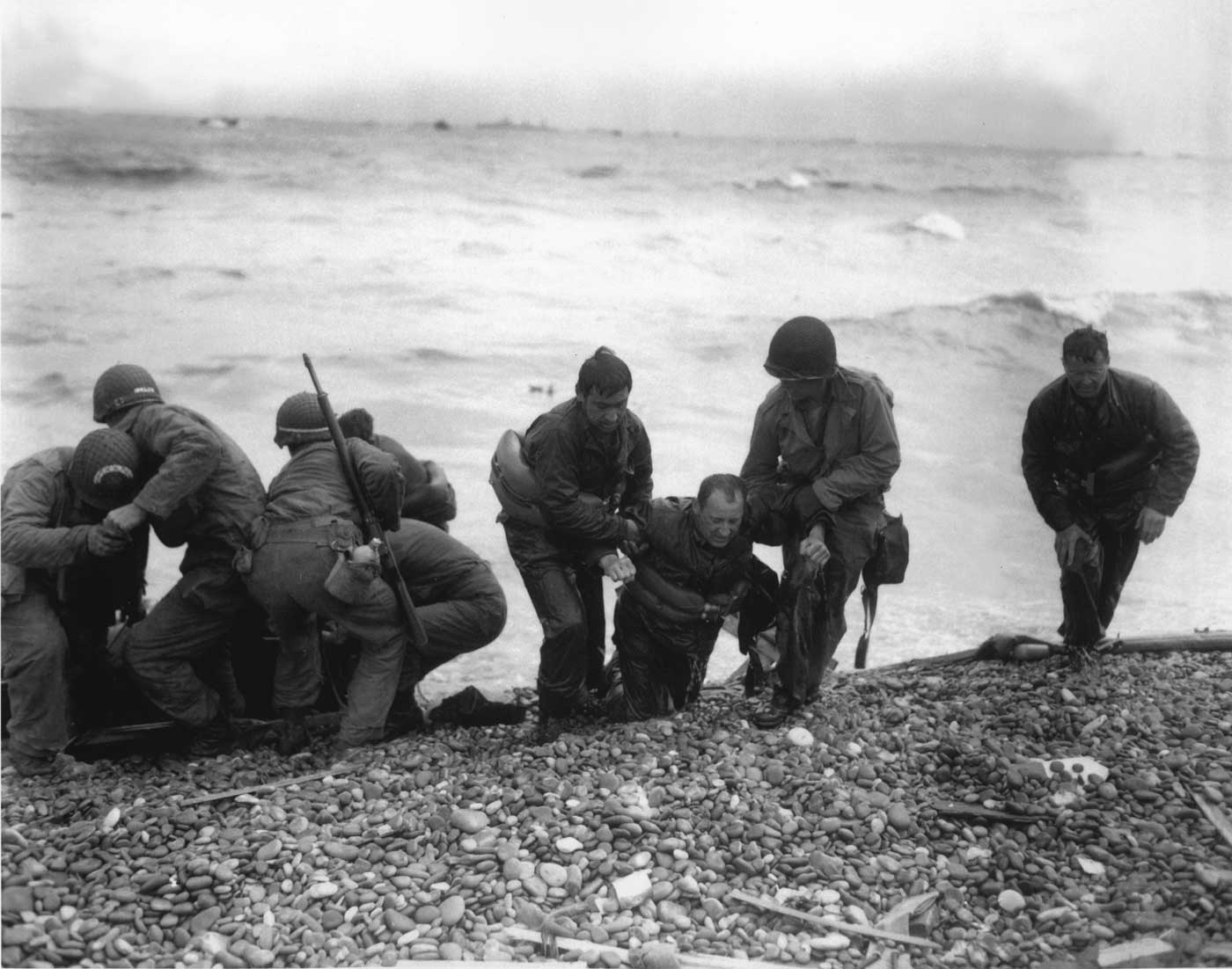 US soldiers struggle on shore at Utah Beach during the Normandy landings