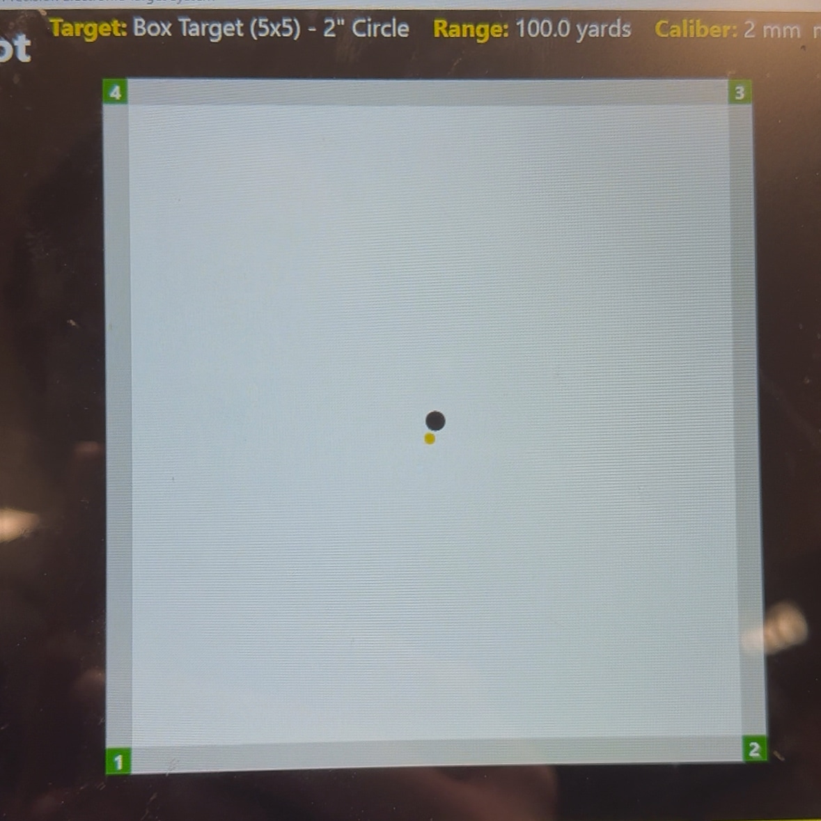 The image shows an electronic target display used to evaluate the accuracy of the EOTECH Vudu 3-9X32 riflescope. On the screen, multiple bullet impacts are marked and measured, indicating group sizes and point of impact. The background shows the scope mounted on an AR-15 during testing. The electronic target system provides real-time feedback, allowing precise adjustments to the optic. The display’s interface shows coordinates, shot numbers, and grouping statistics. This setup helps confirm zero and assess the optic’s repeatability under live-fire conditions.