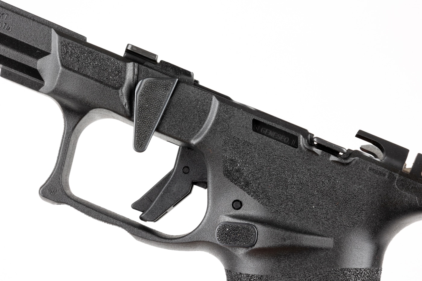 The image shows a Springfield Armory Echelon 4.0C pistol in the early stages of field stripping, with the slide removed and laid to the side of the frame. The grip module, frame, and exposed Central Operating Group are visible, illustrating the process needed before swapping grip modules. The work area is clean and well-lit, emphasizing the importance of safety and order during disassembly. The pistol is clearly unloaded, with no magazine or ammunition present. This photo highlights that removing the slide is a necessary step before accessing the Central Operating Group and changing the grip module. The setup is straightforward and follows Springfield’s recommended procedure for modular changes. This image is useful for anyone unfamiliar with the field stripping process for the Echelon 4.0C.