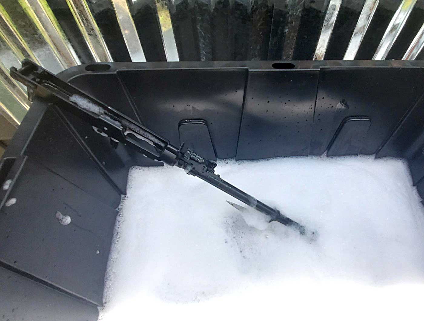 scrubbing the barrel with soap and water