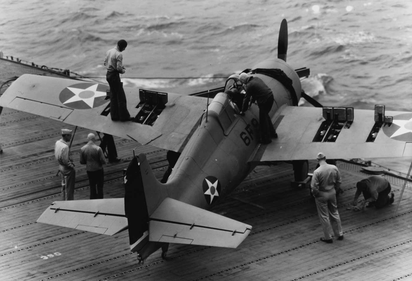 testing the Browning 50 caliber machine guns on F4F Wildcat while at sea