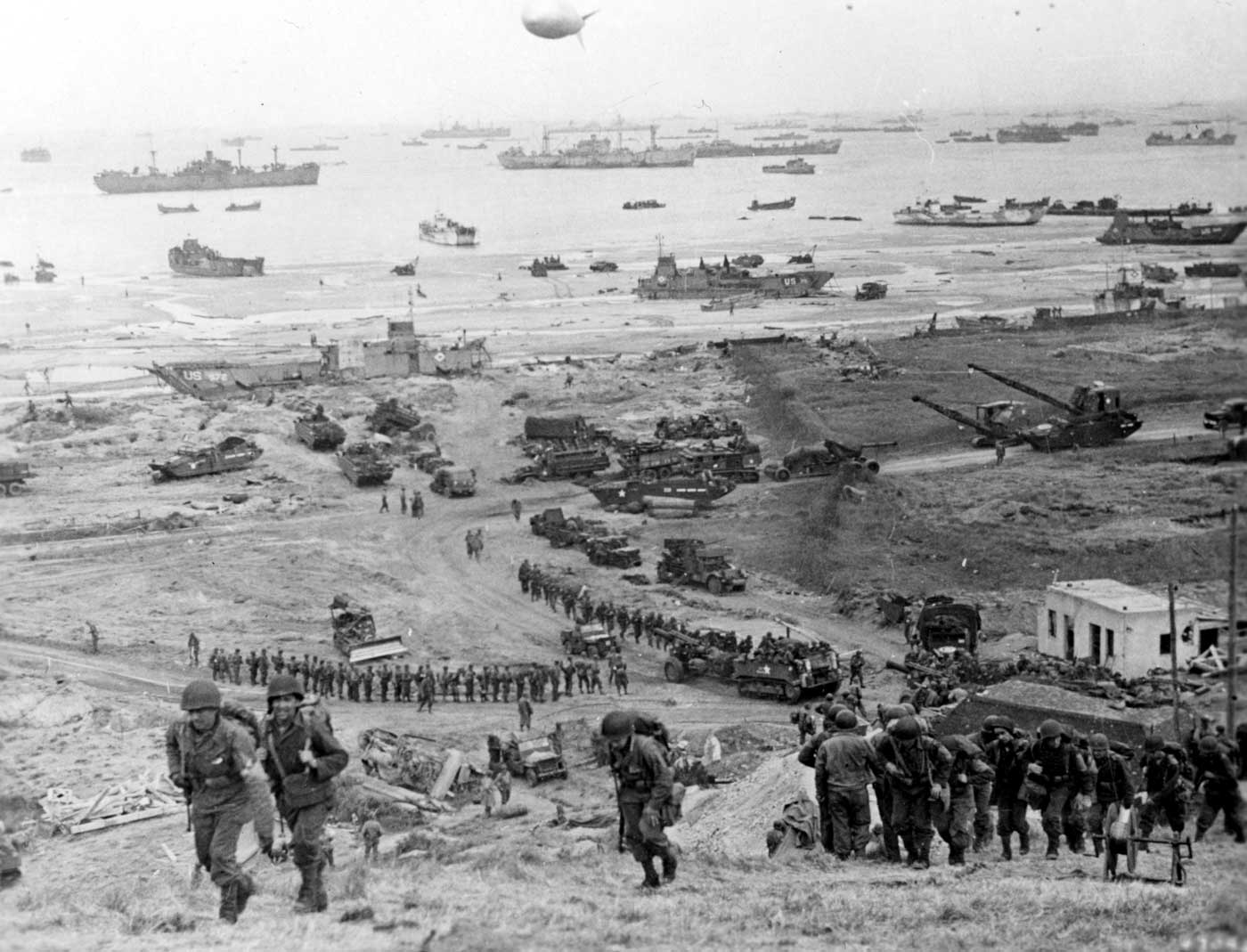 troops tanks and supplies move over the Normandy beaches during Operation Overlord